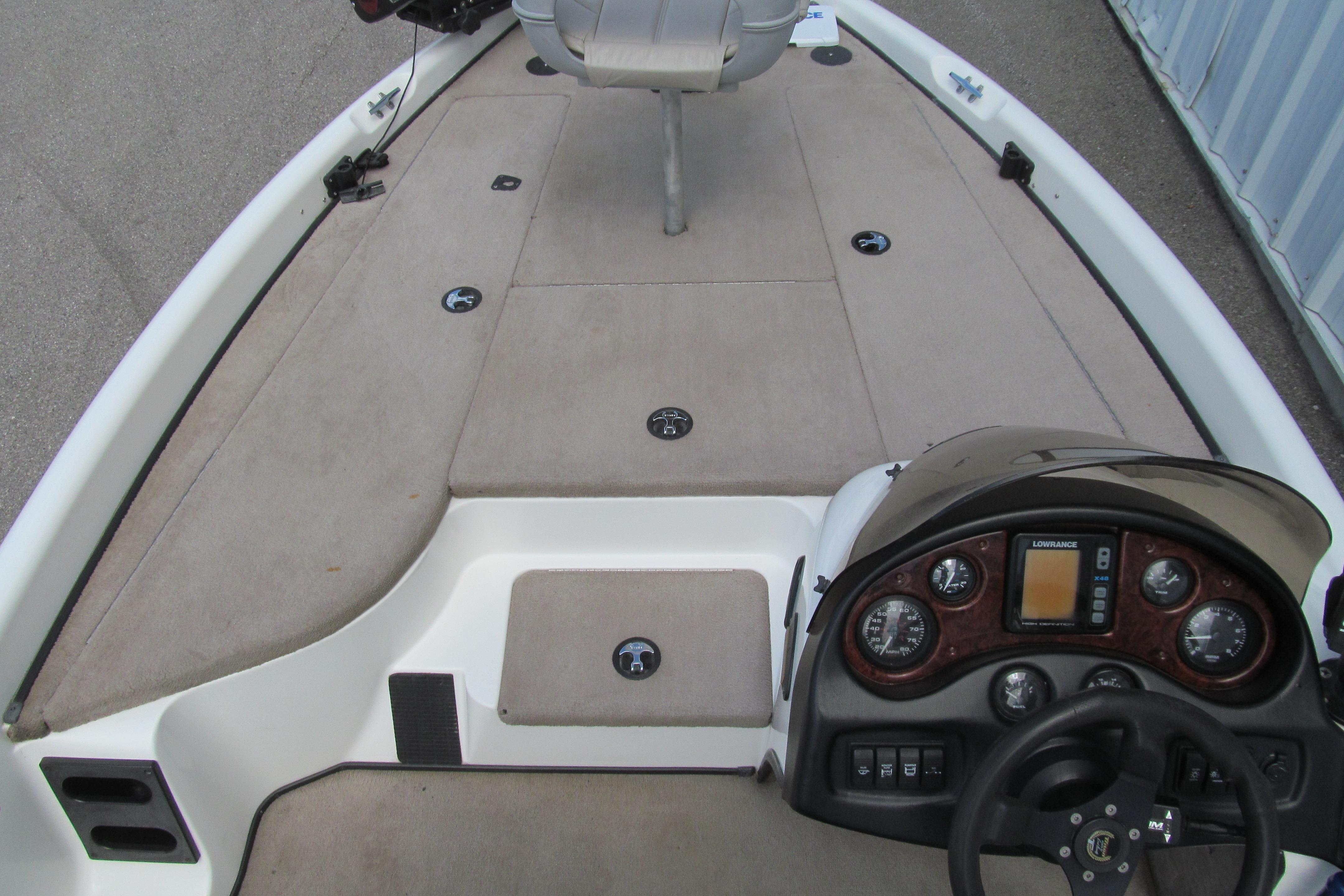 2002 Triton Tr-176 SC boat interior with steering console and seating area.