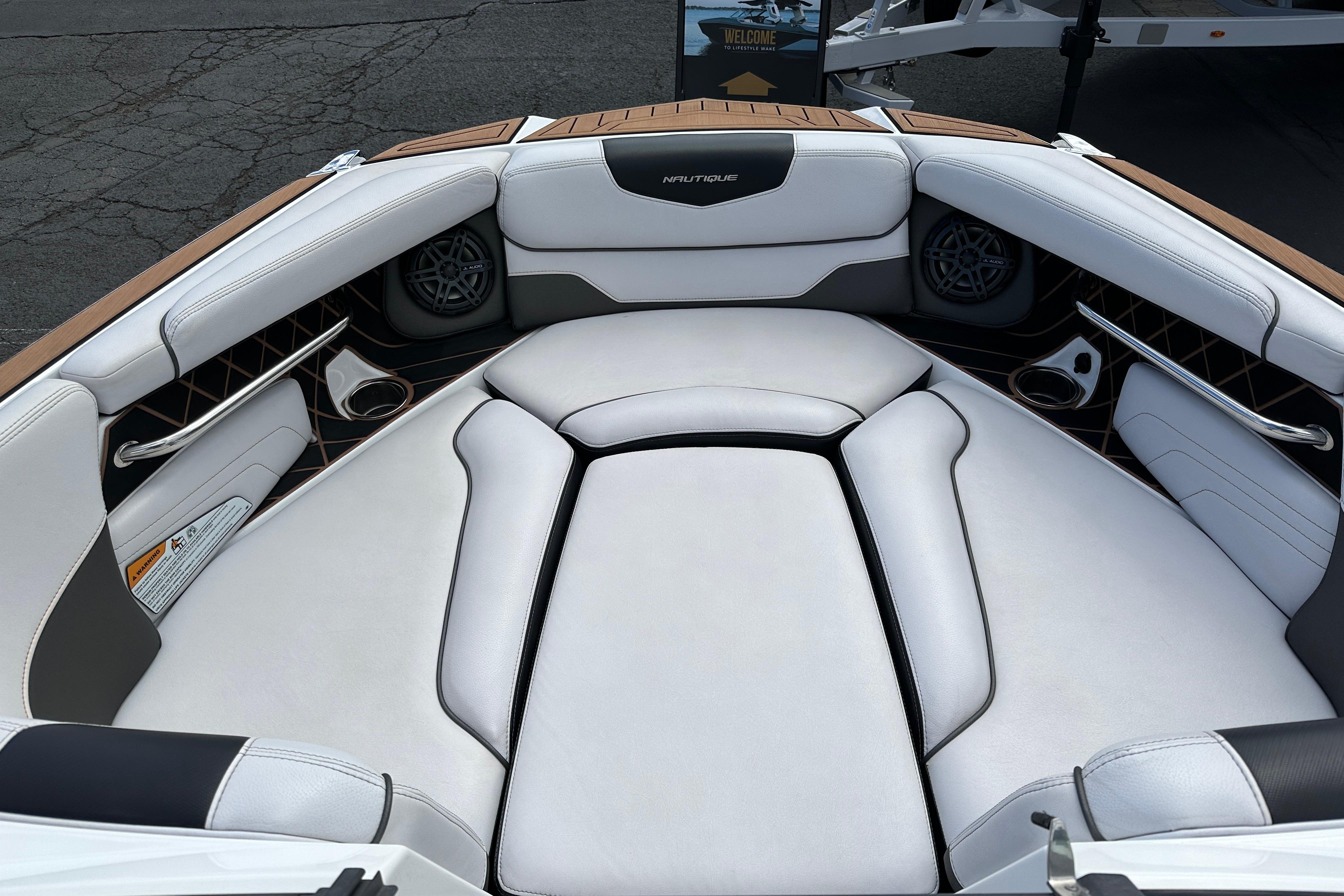 2017 Nautique Super Air Nautique GS20 boat interior with white seating and speakers.