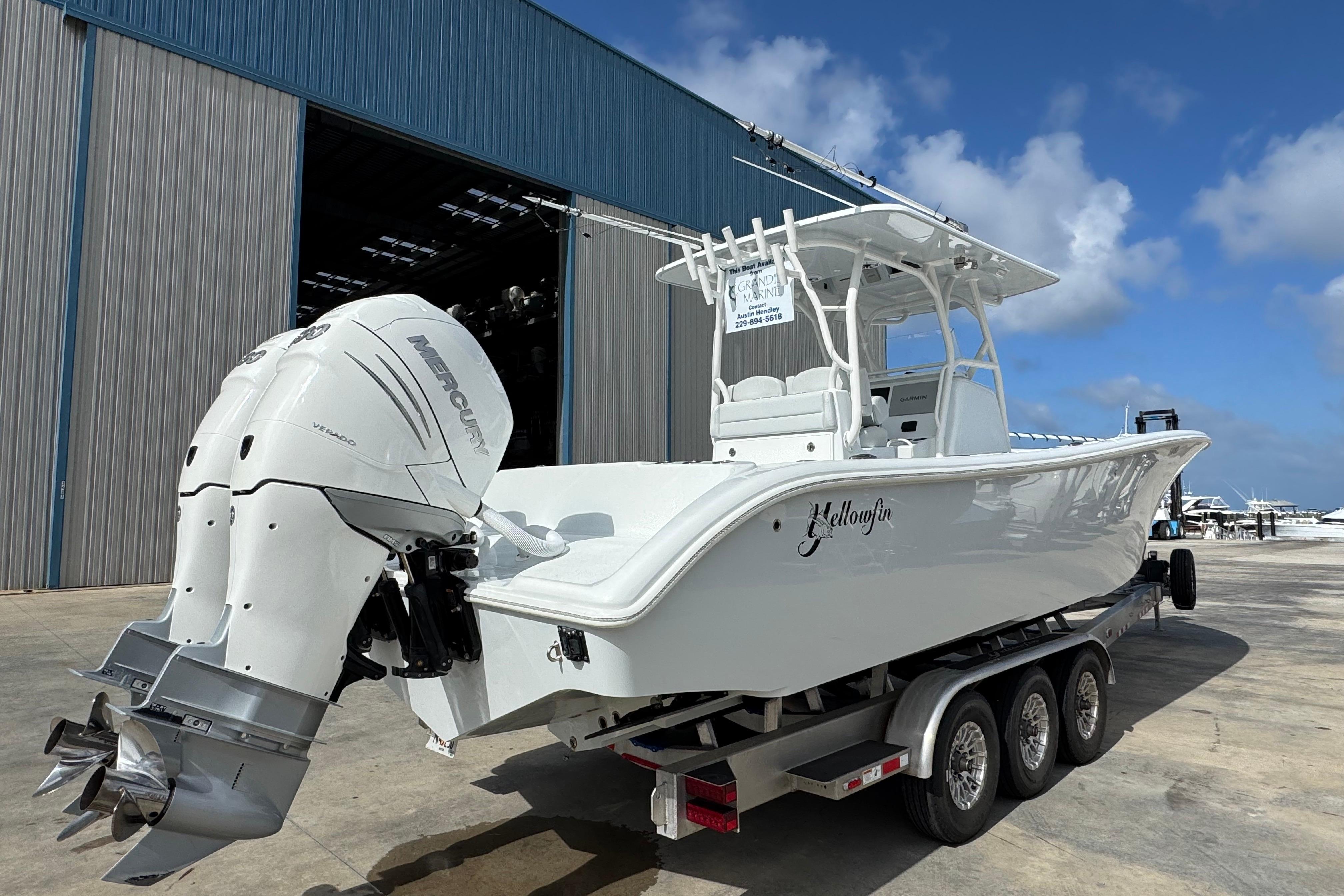 2022 Yellowfin 32 Offshore boat with twin Mercury engines on a trailer.
