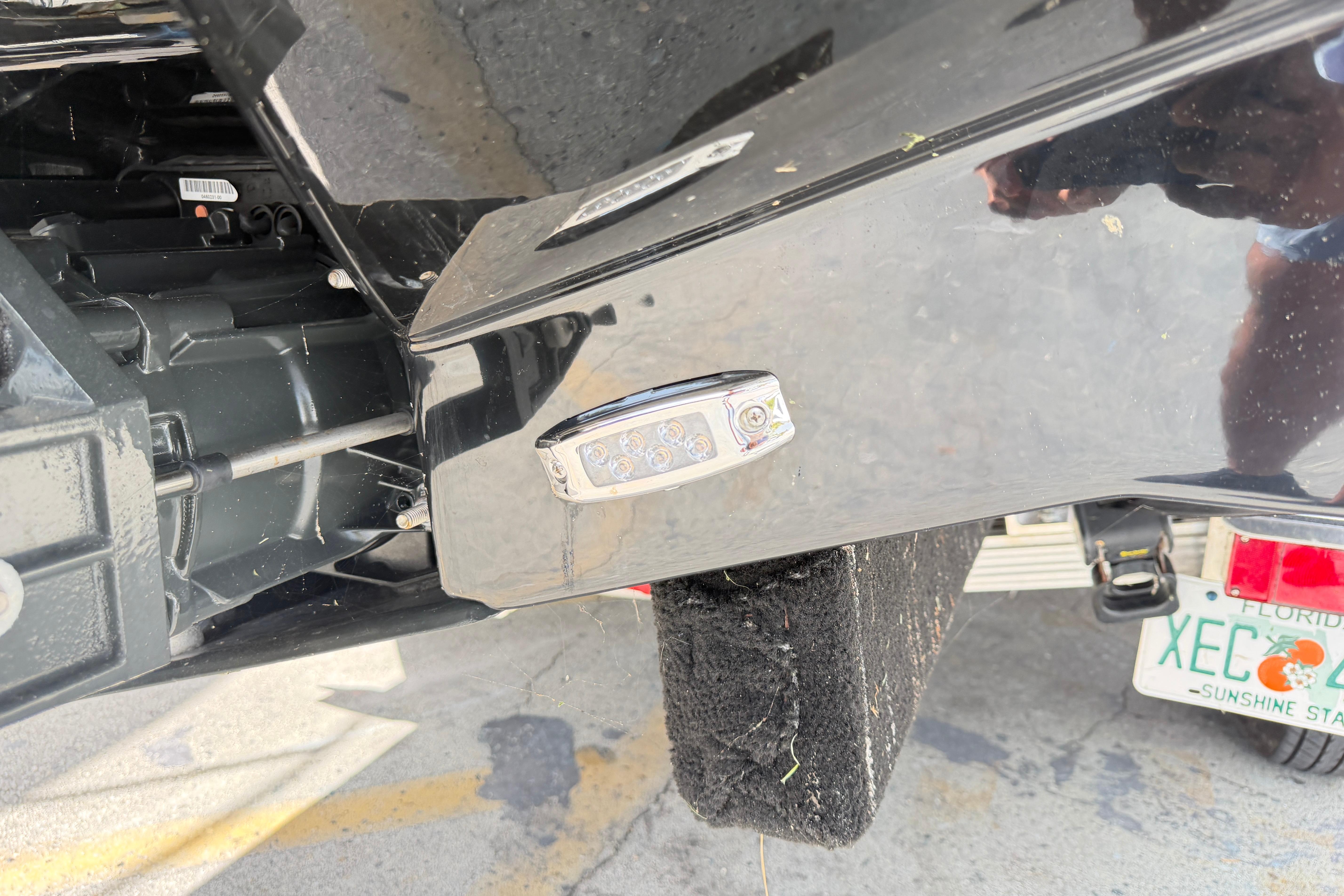 Close-up of a 2026 Scarab 235 LX boat's rear section with Florida license plate.