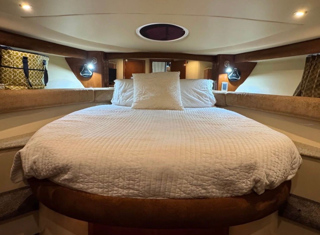 Interior of a 2007 Meridian 411 Sedan yacht with cozy bed.