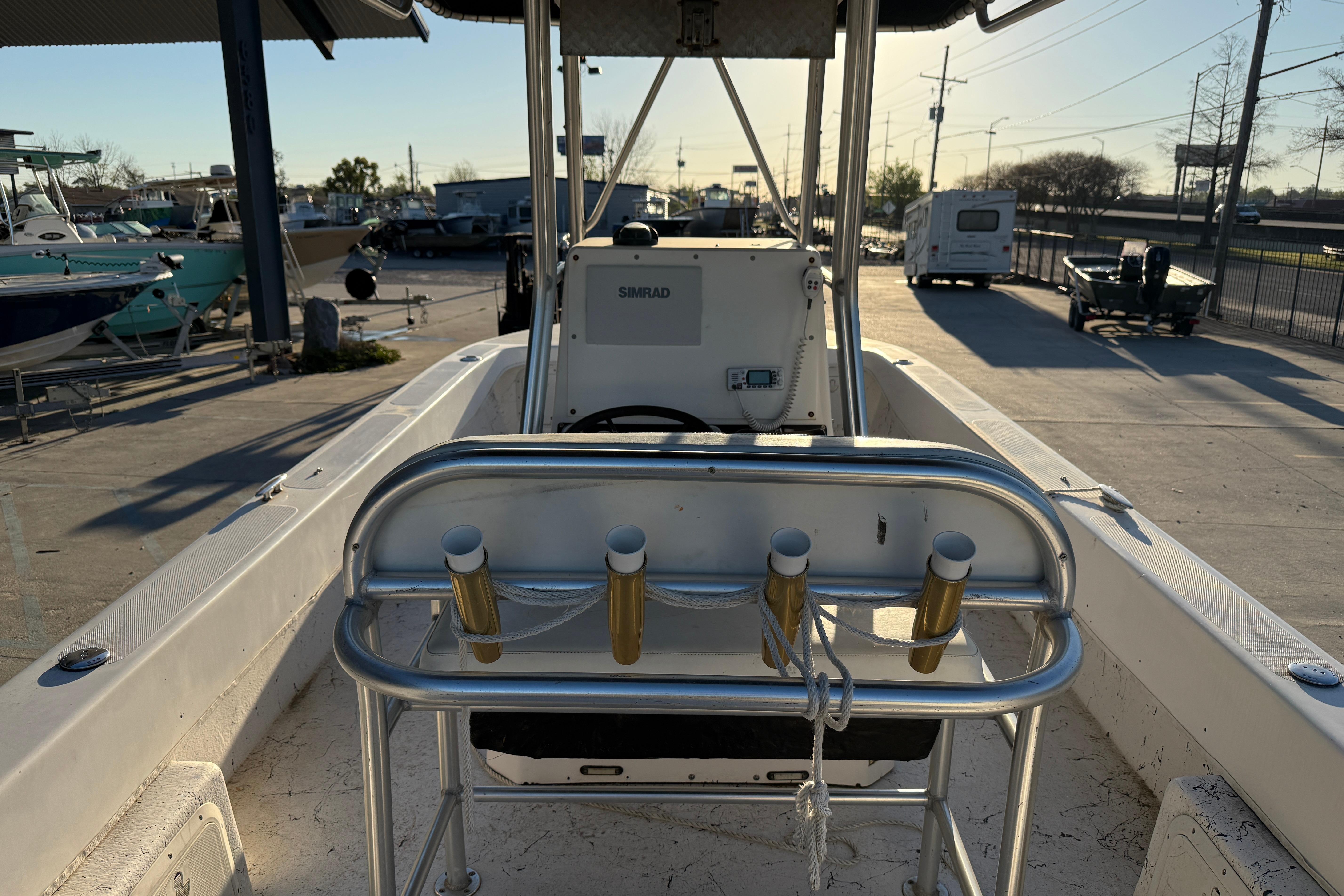 2007 Twin Vee 26 Center Console boat with rod holders and Simrad electronics.