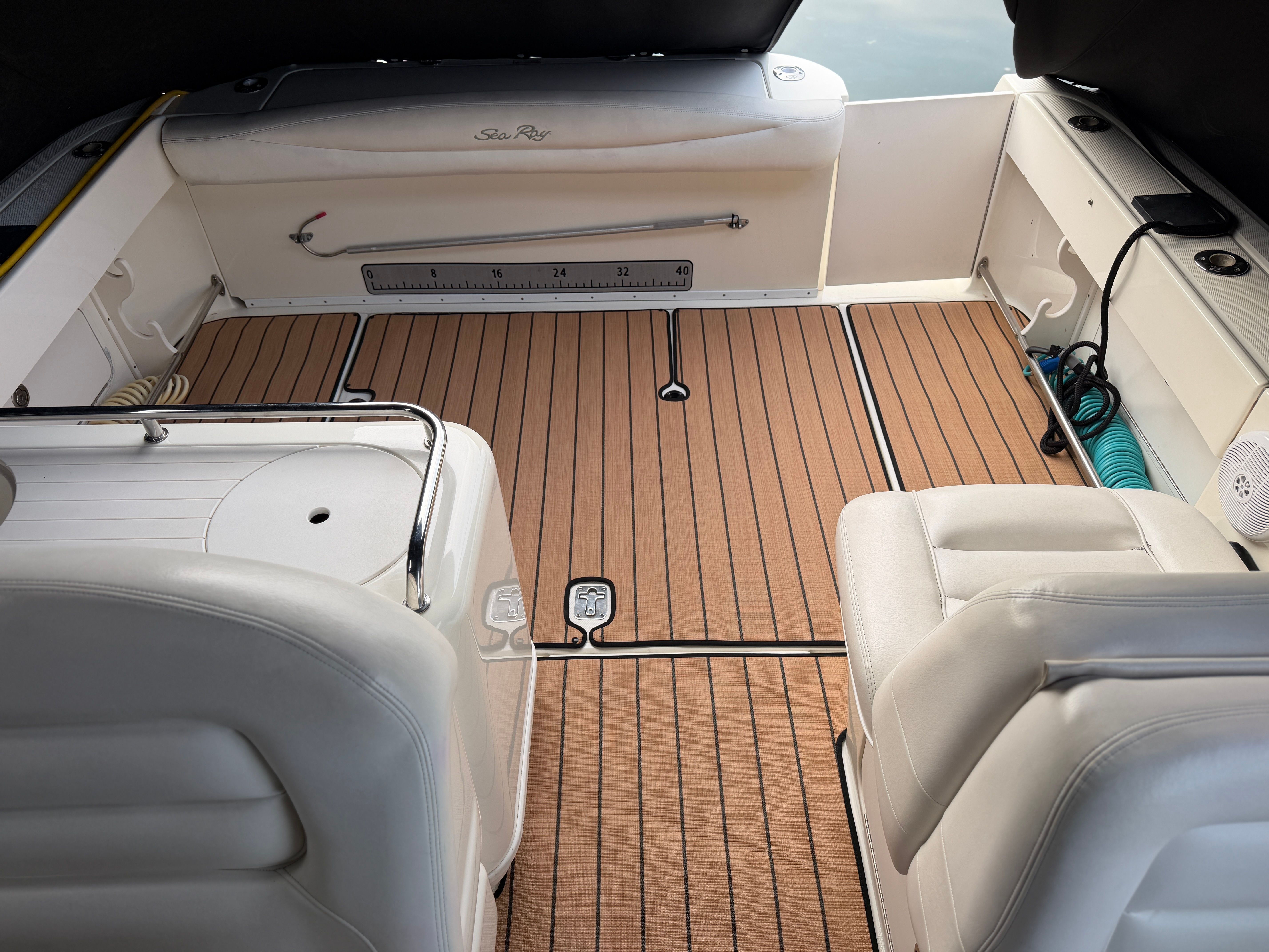 Interior of a 2005 Sea Ray 290 Amberjack with wooden flooring.