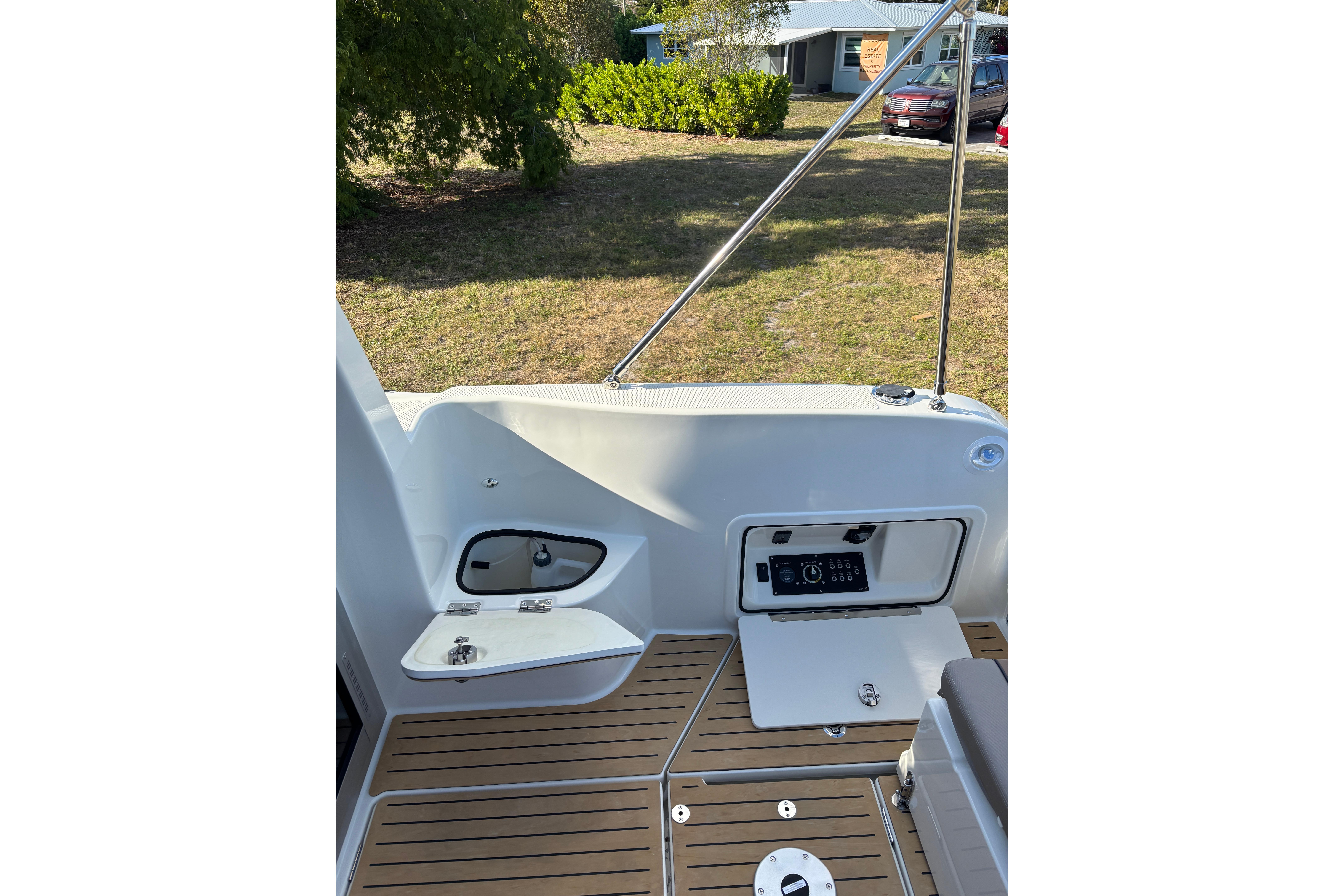 2026 Trophy T 25 Explorer boat deck with storage compartments and control panel.