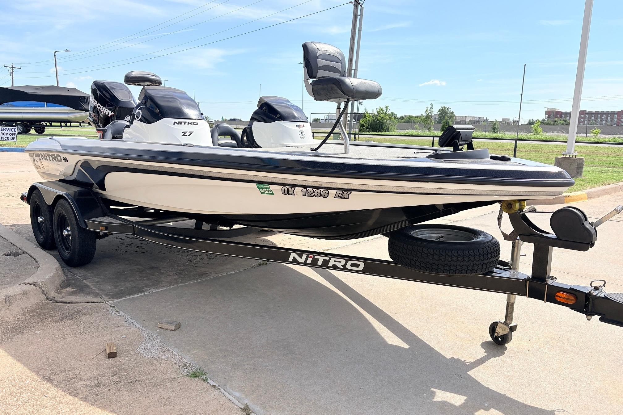 2011 Nitro Z-7 boat on trailer, parked outdoors under clear sky.