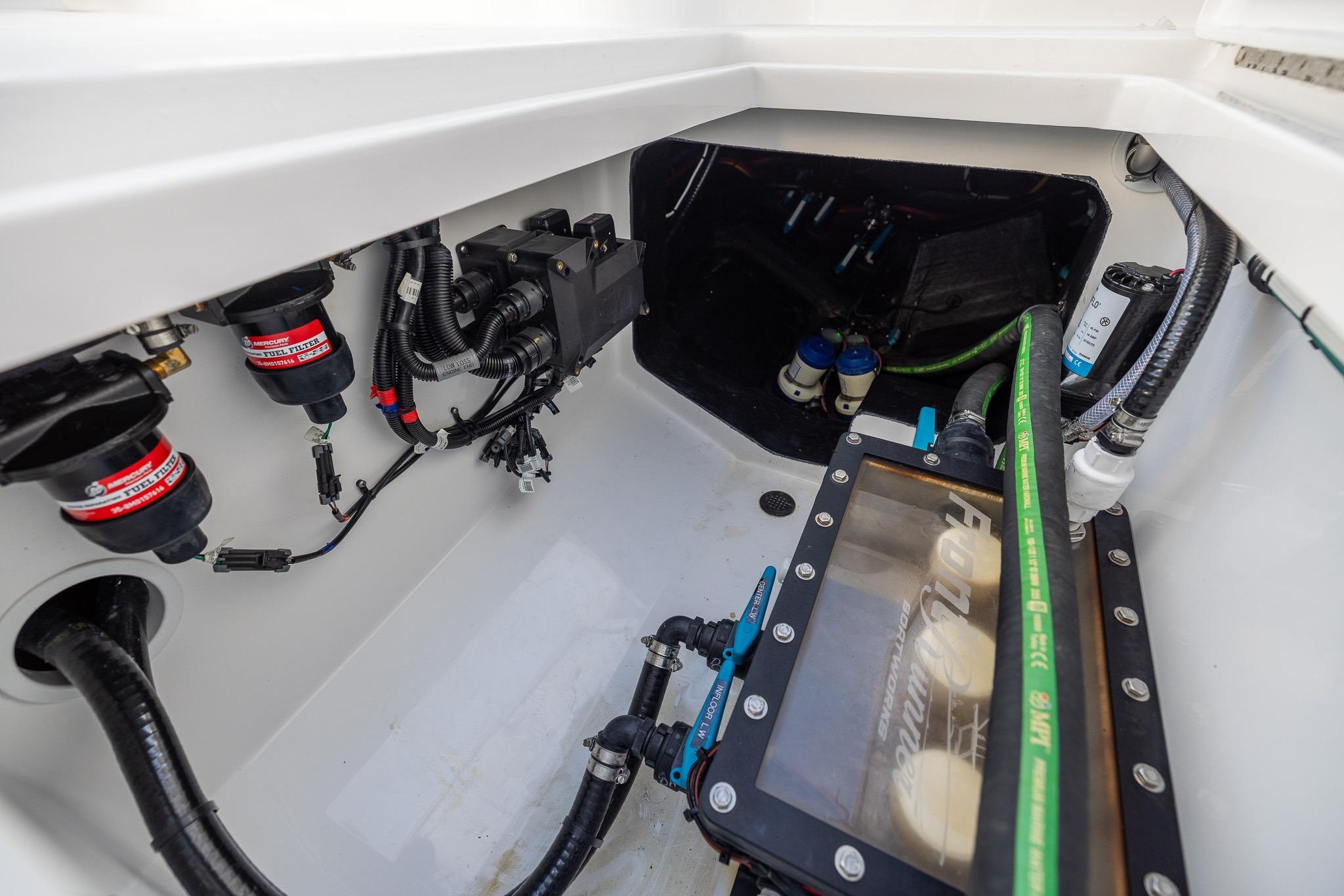 Engine compartment of 2026 Front Runner 37 Catamaran, showcasing wiring and components.