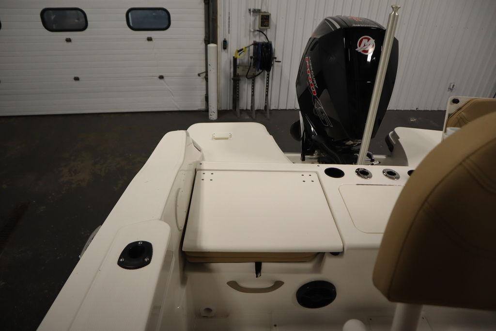2026 Bayliner Trophy T20CC boat interior with motor, storage, and seating features.