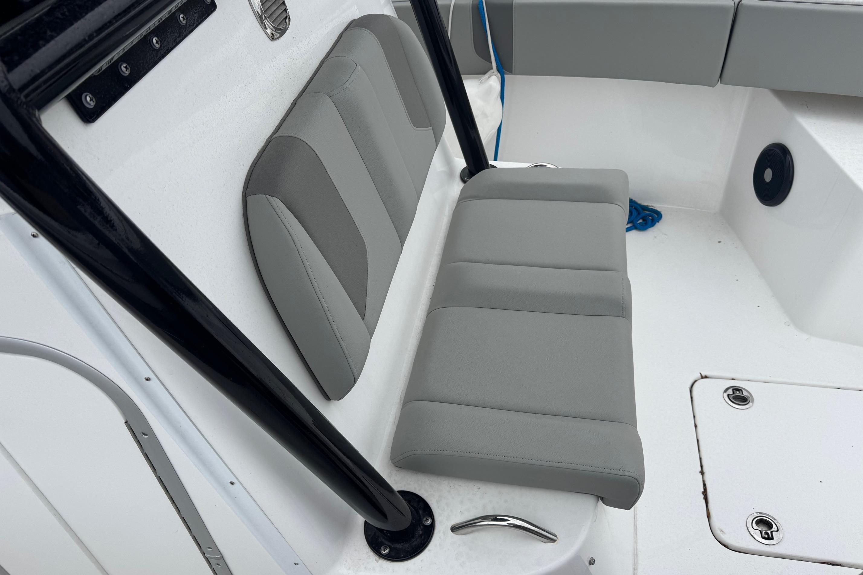 2024 Cape Horn 32 XS boat interior with gray cushioned seating and sleek design.