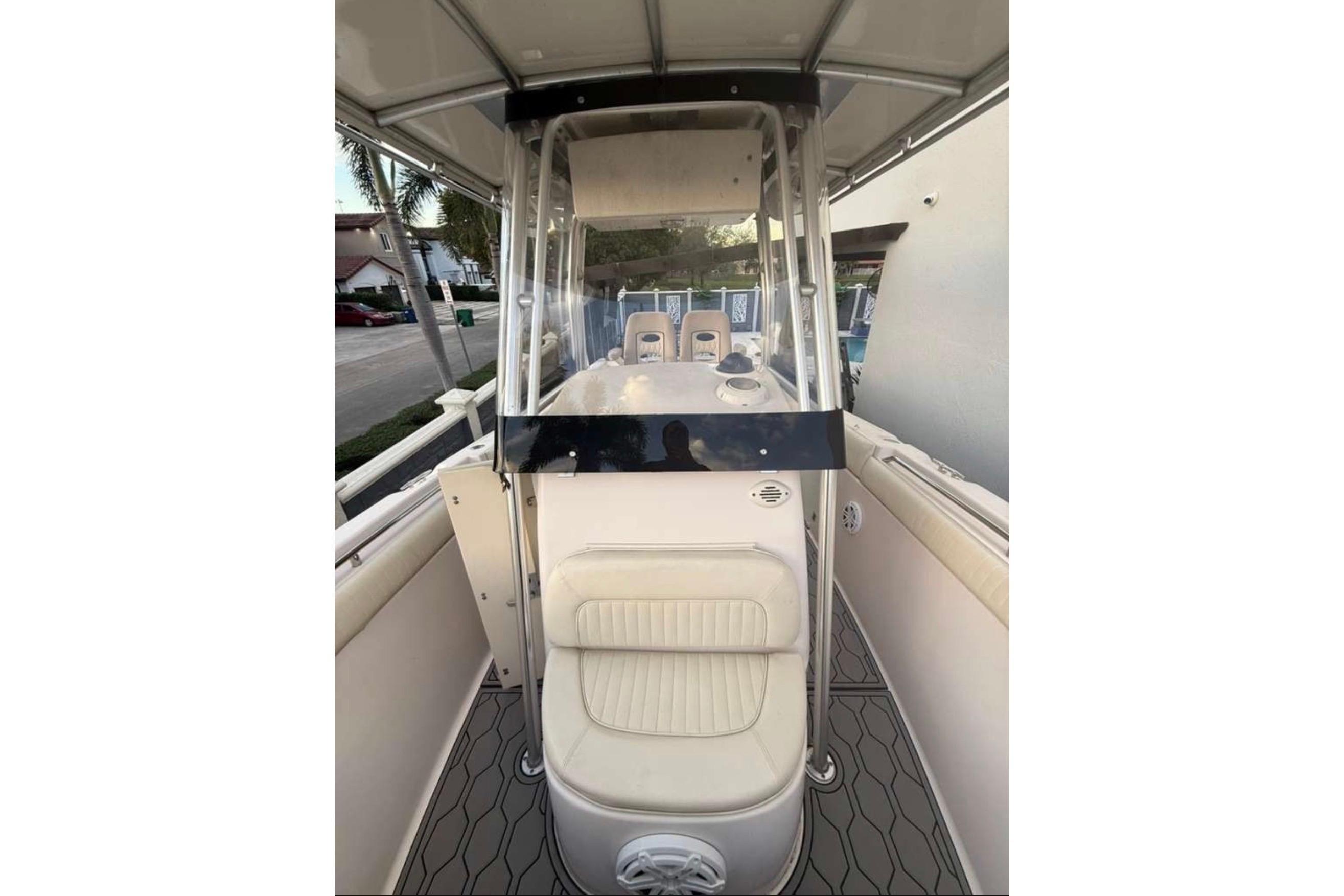 2004 Grady-White Chase 273 boat interior with seating and console view.