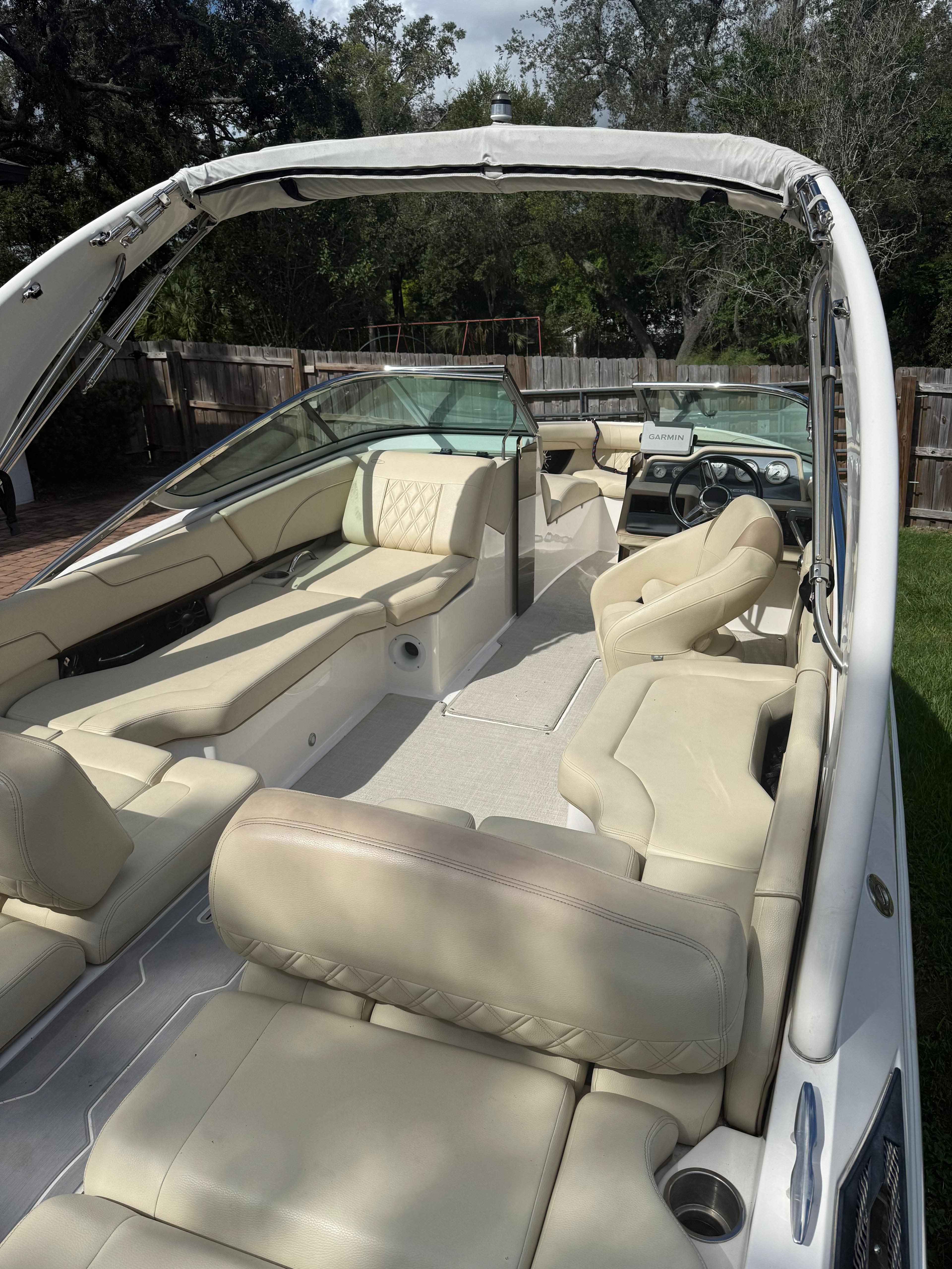 Interior view of a 2020 Regal 2300 Bowrider boat with beige seating.