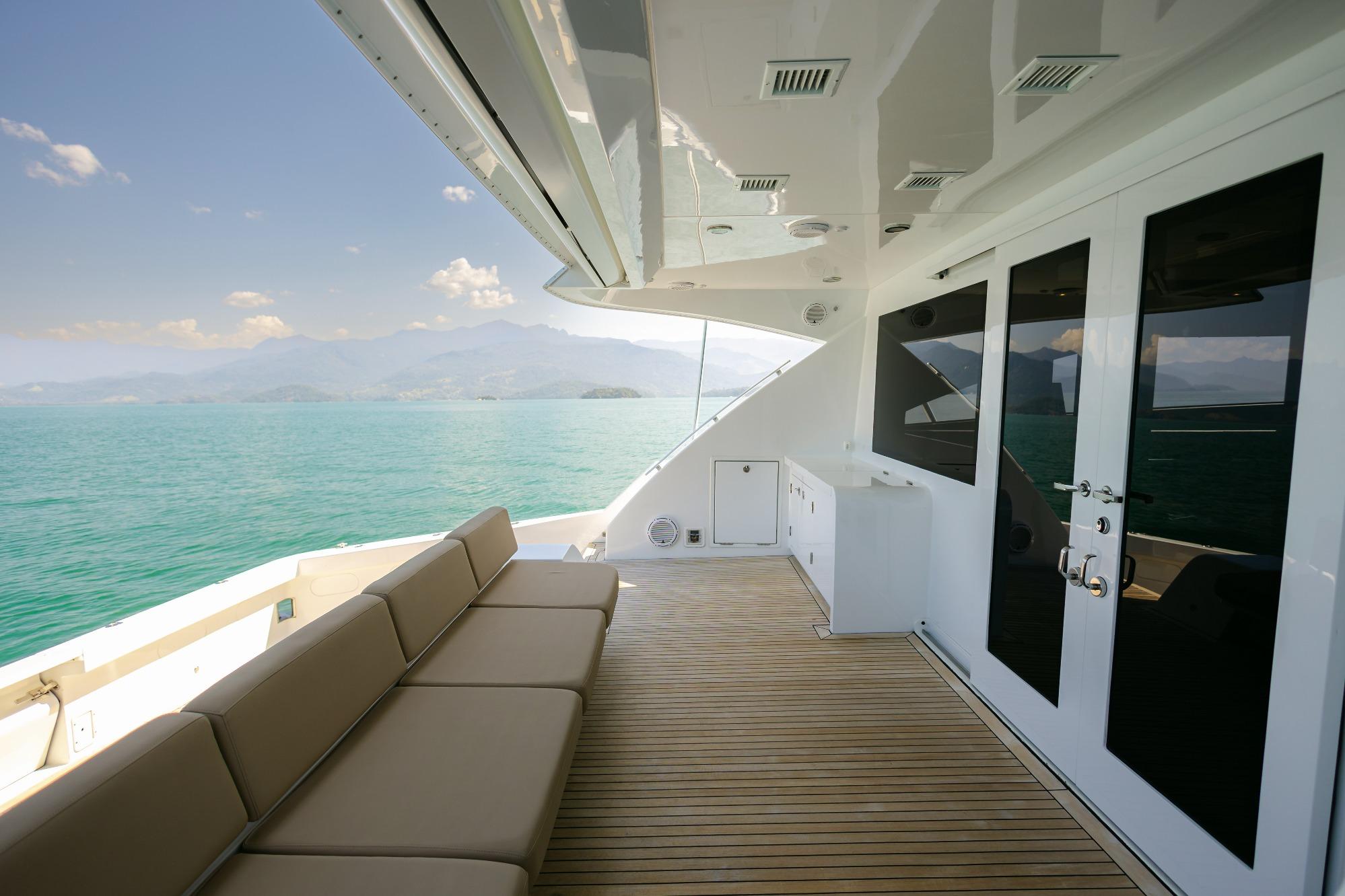 Luxurious 2008 Pro Boat Yachts Power Cat 80 deck with seating, overlooking serene ocean view.