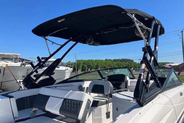 2024 Monterey M-65 boat with sleek design and spacious seating under a sunny sky.