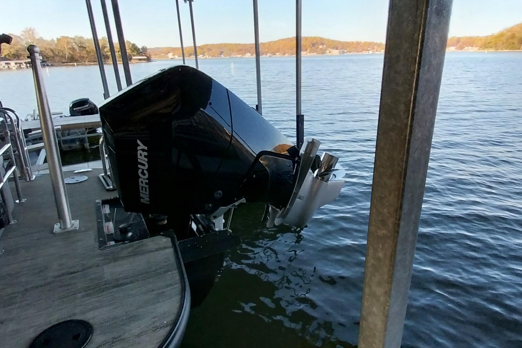 2023 Ranger 2500LS boat with Mercury outboard motor docked on a serene lake.