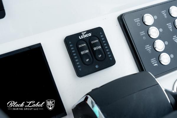 Control panel of 2025 Caymas 281 HB boat with Lenco trim tab switches.