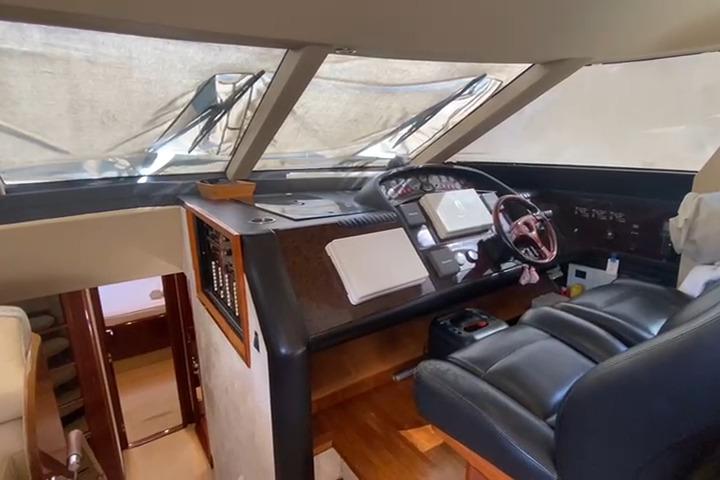 Helm of 2007 Princess 21M yacht with leather seating and navigation controls.