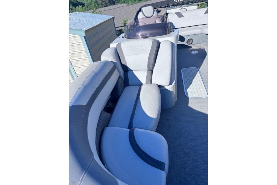 2022 Sylvan L3 DLZ Bar boat interior with plush seating and modern design.