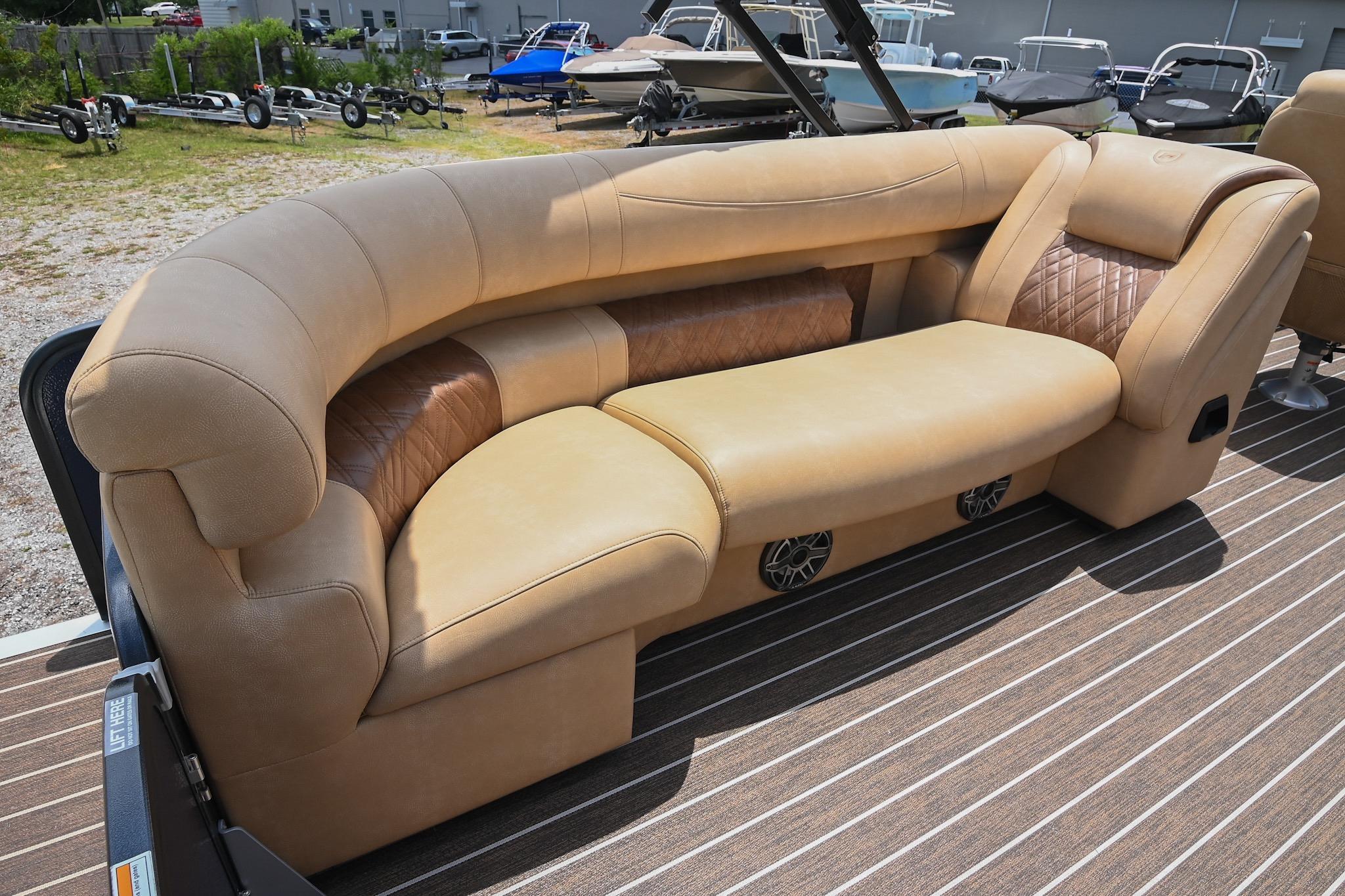 Luxurious seating on 2023 Premier 270 Intrigue RF boat, featuring tan upholstery and stylish design.