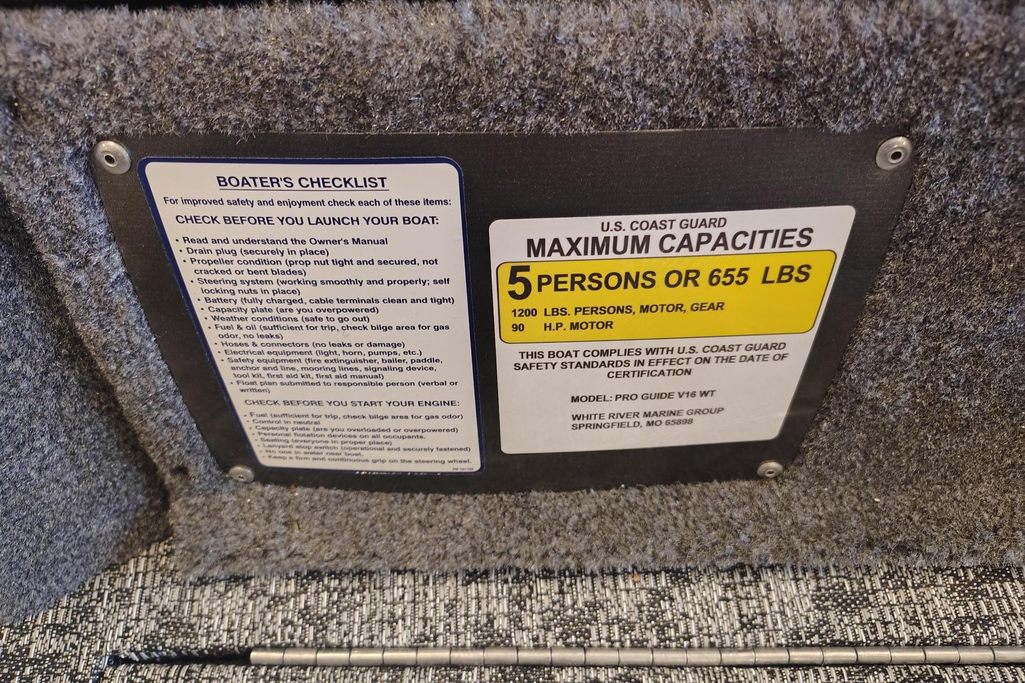 Boater's checklist and capacity label on 2026 Tracker Pro Guide V-16 WT boat.