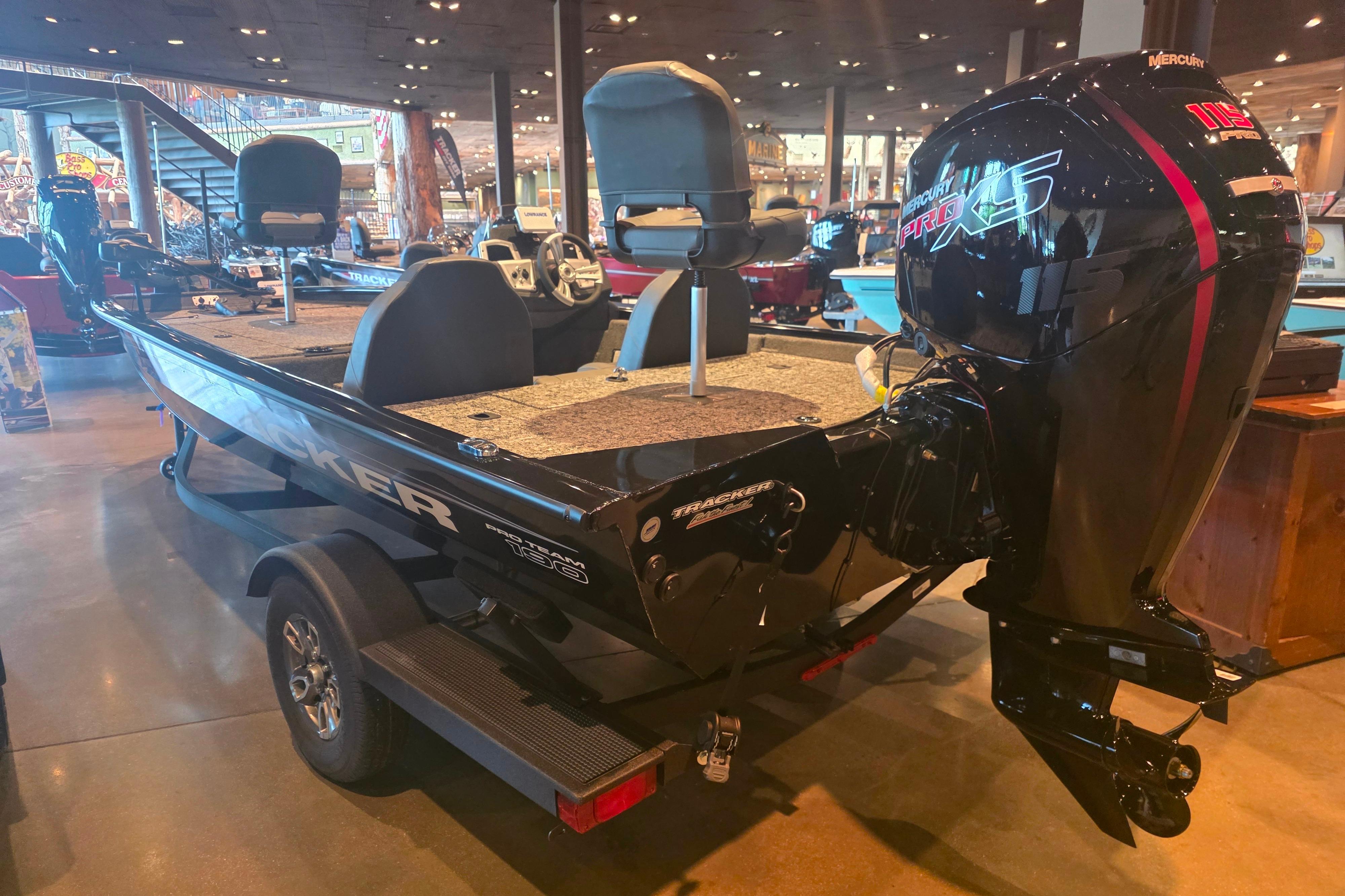 2026 Tracker Pro Team 190 boat with Mercury Pro XS engine in showroom.