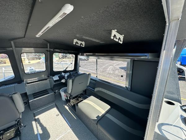Interior of 2024 Spartan 260 Maximus Pro XL boat with seating and control console.