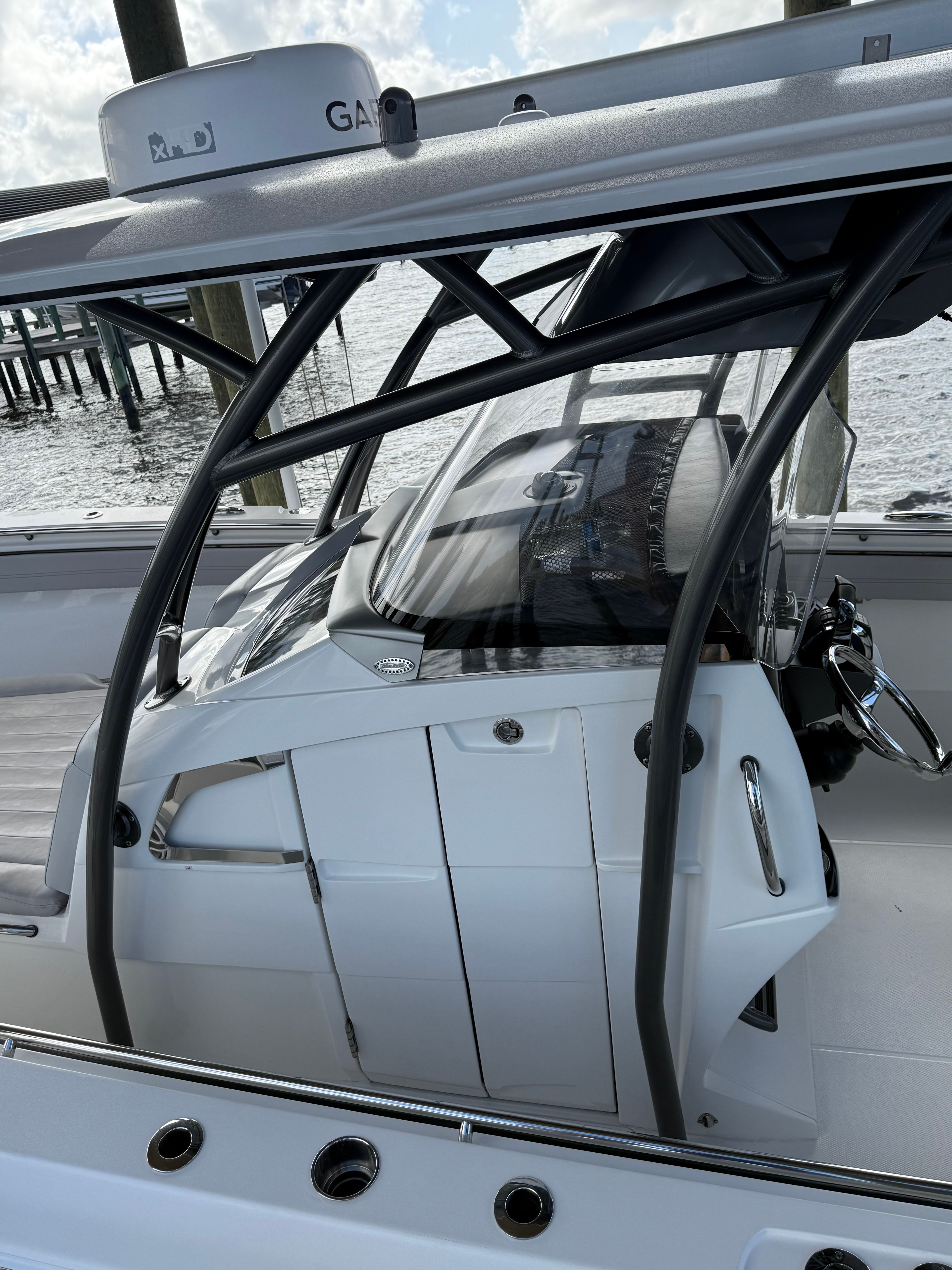 2018 Nor-Tech 392 Super Fish boat cockpit view by the water.