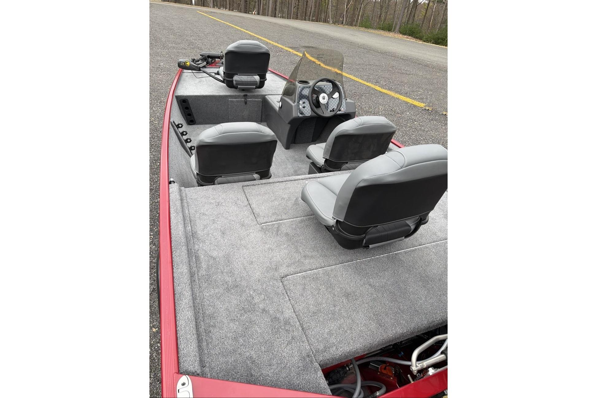 2026 Tracker Bass Tracker Classic XL boat interior with gray seating and steering console.