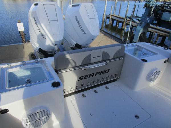 2024 Sea Pro 322 Offshore boat with dual Mercury engines at dock.