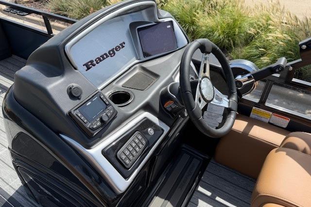 2026 Ranger 223F boat dashboard with steering wheel, electronic controls, and navigation display.