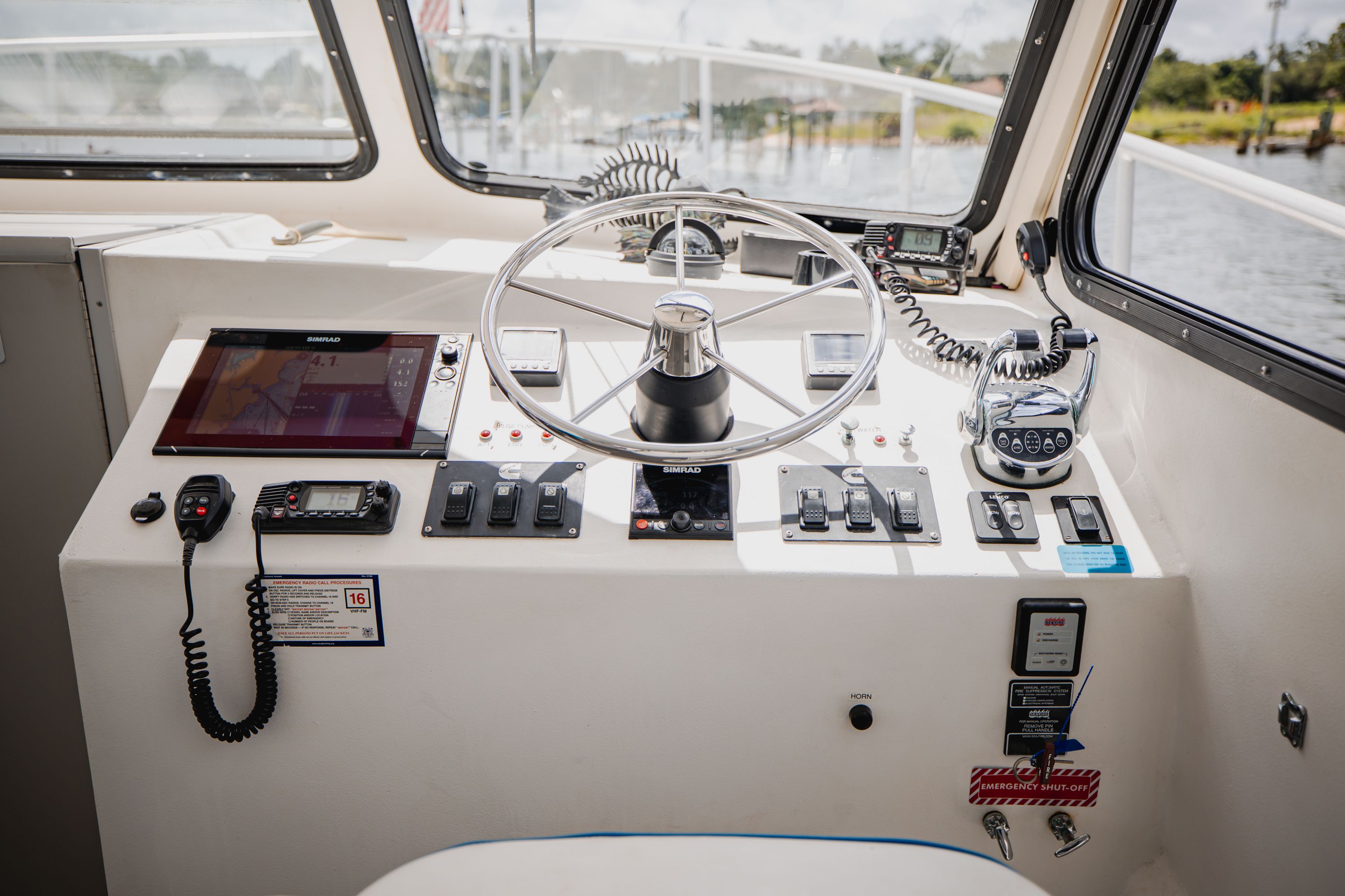 The helm of a 2019 Newton 36' Dive Special boat with modern electronics.