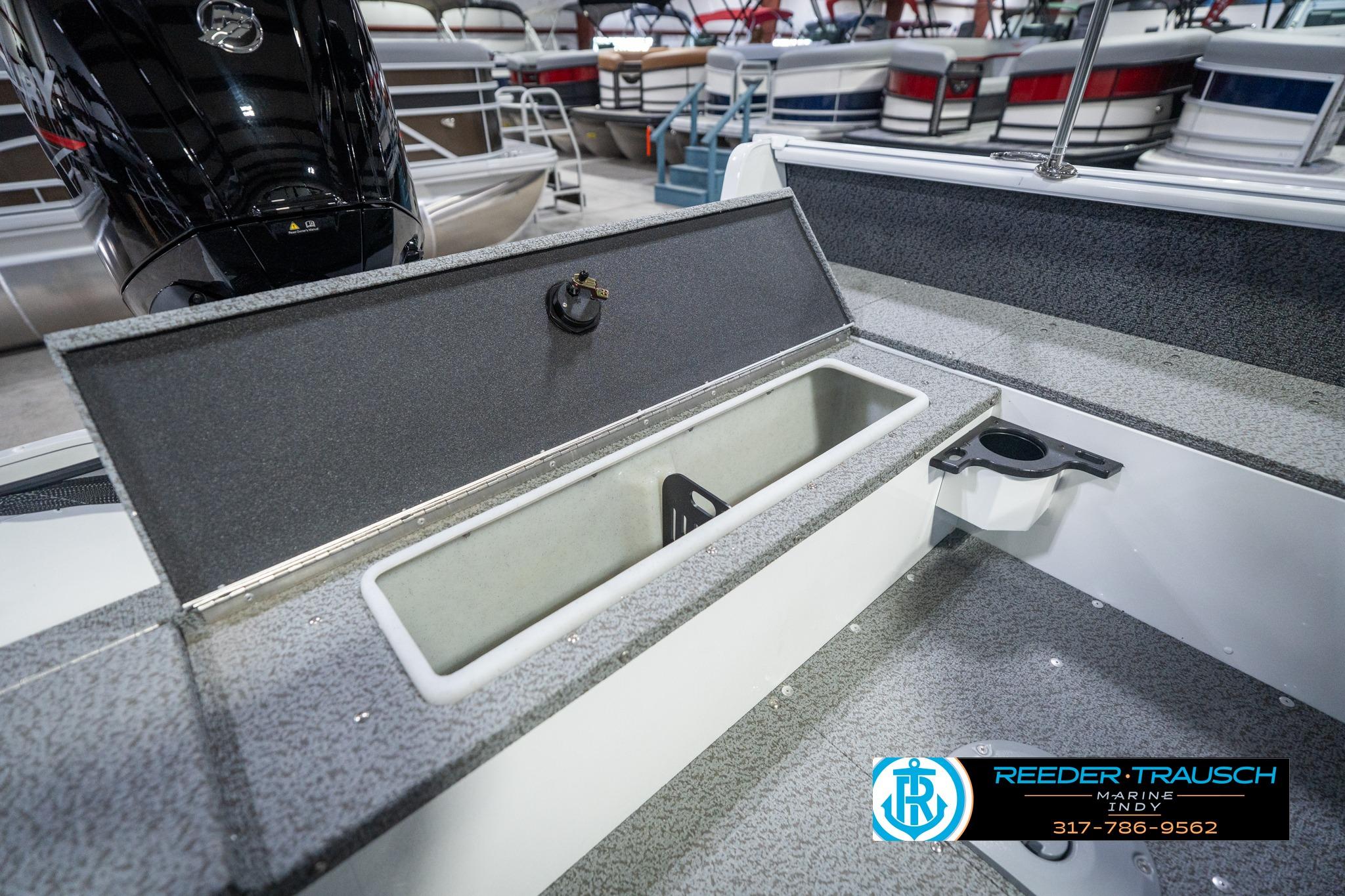 2026 Lund 1700 Explorer Sport boat interior with storage compartment and cup holder.