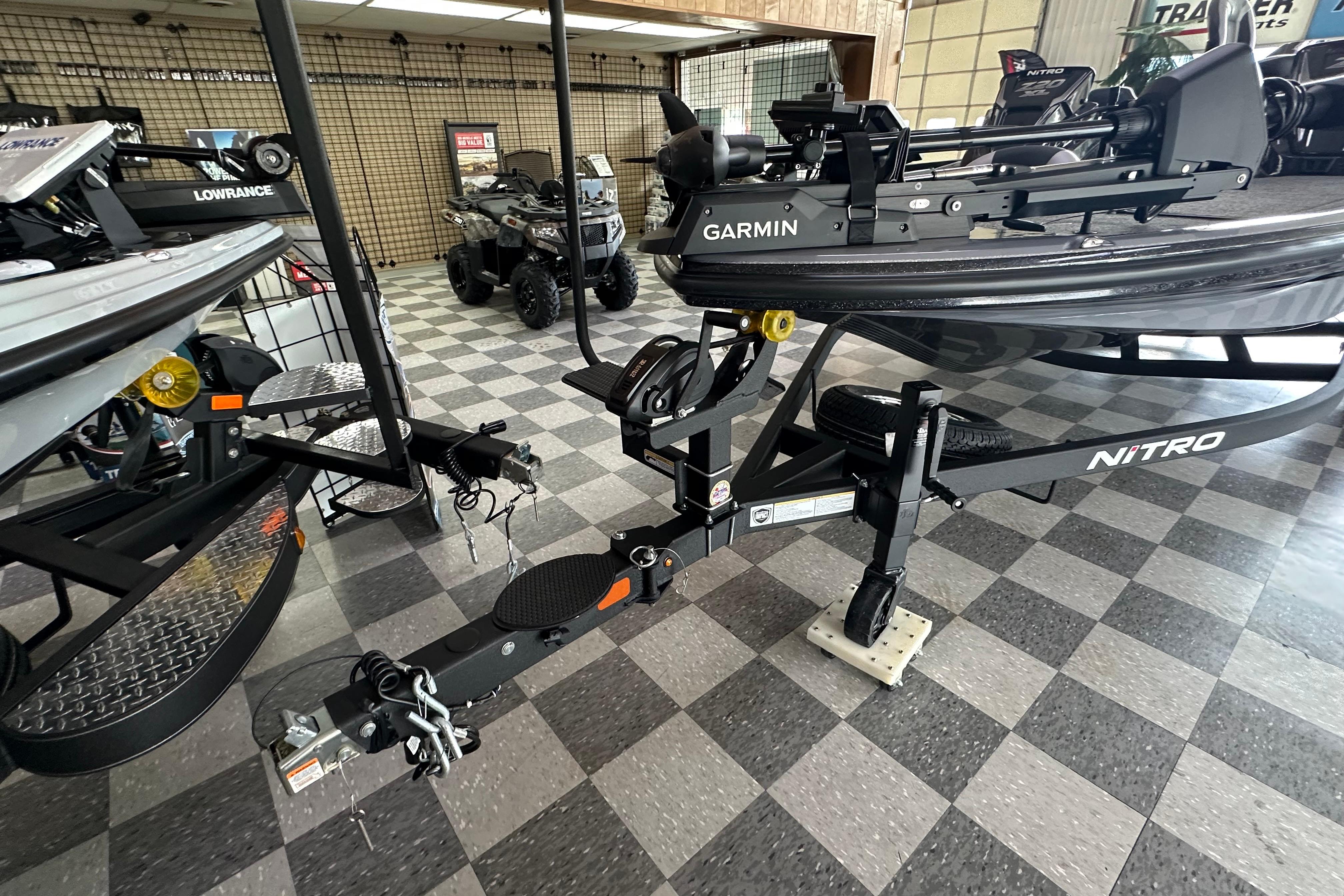 2025 Nitro Z20 XL Pro boat with Garmin equipment on showroom floor.