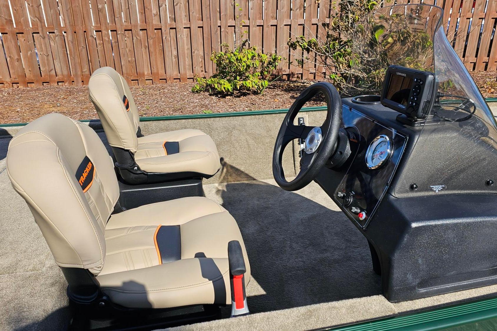 2026 Tracker Bass Tracker Classic Limited boat interior with beige seats and steering console.
