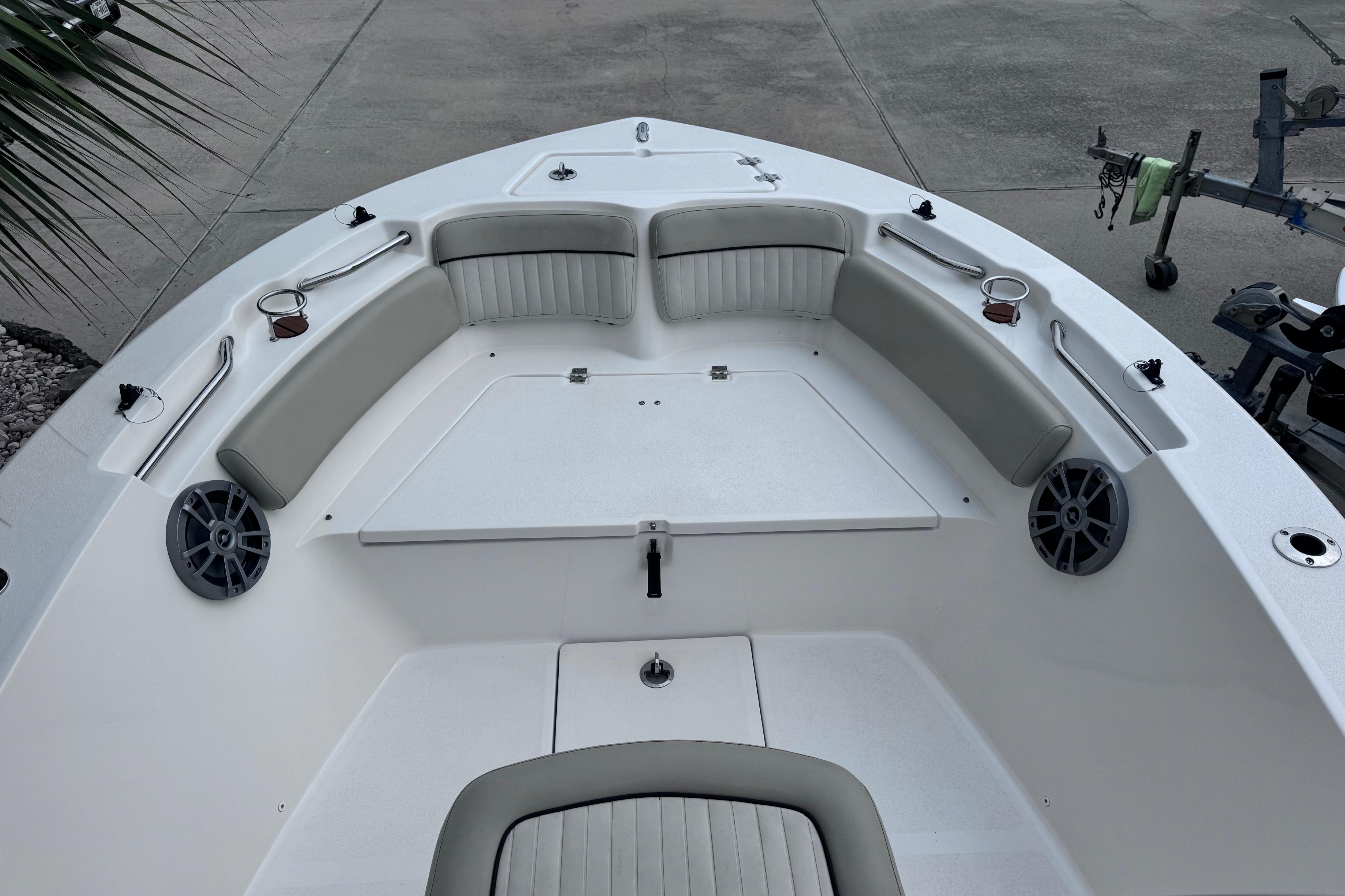 2018 Sea Fox 206 Commander boat interior with cushioned seating and cup holders.