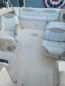 Interior of a 1996 Wellcraft 2400S boat with white seating.