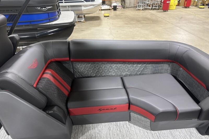 2026 Bennington 24 MFBSF boat interior with sleek gray and red seating.