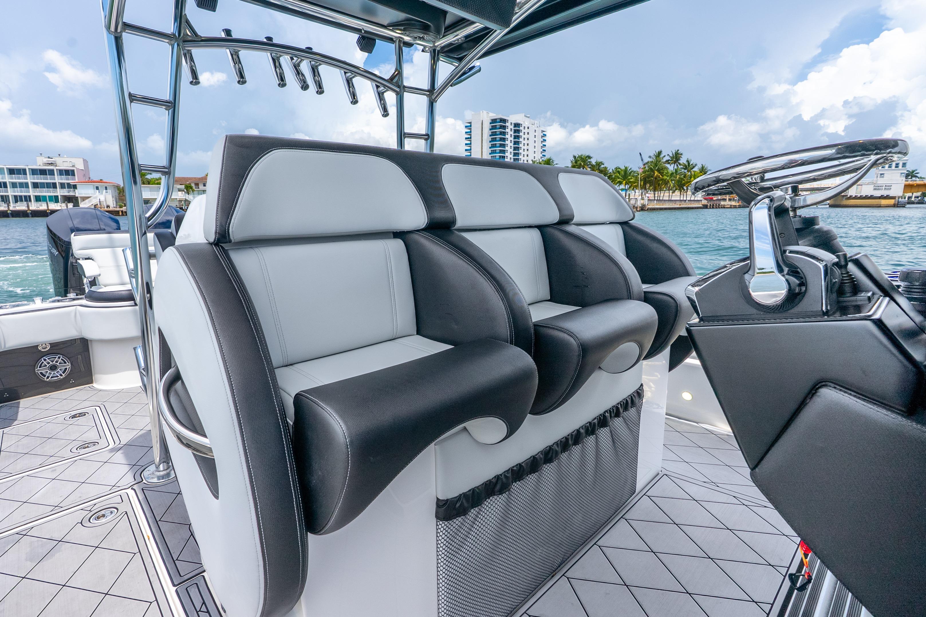 2024 Nor-Tech 452 Super Fish boat interior with luxurious seating and modern steering console.