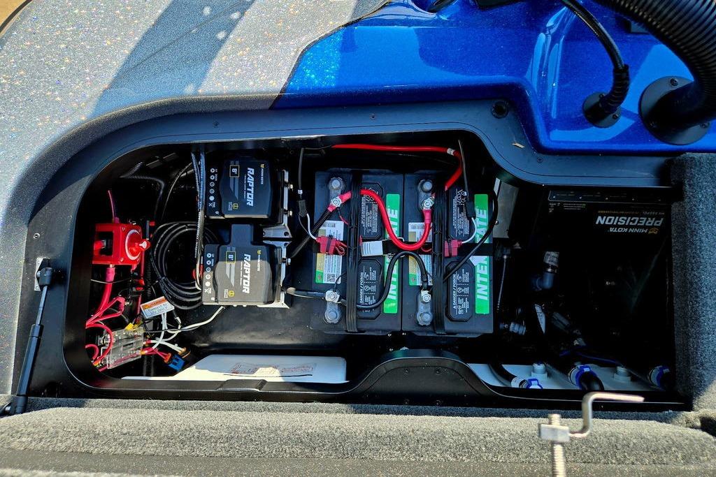 Battery compartment of 2026 Skeeter ZXE20 boat with wiring and components.