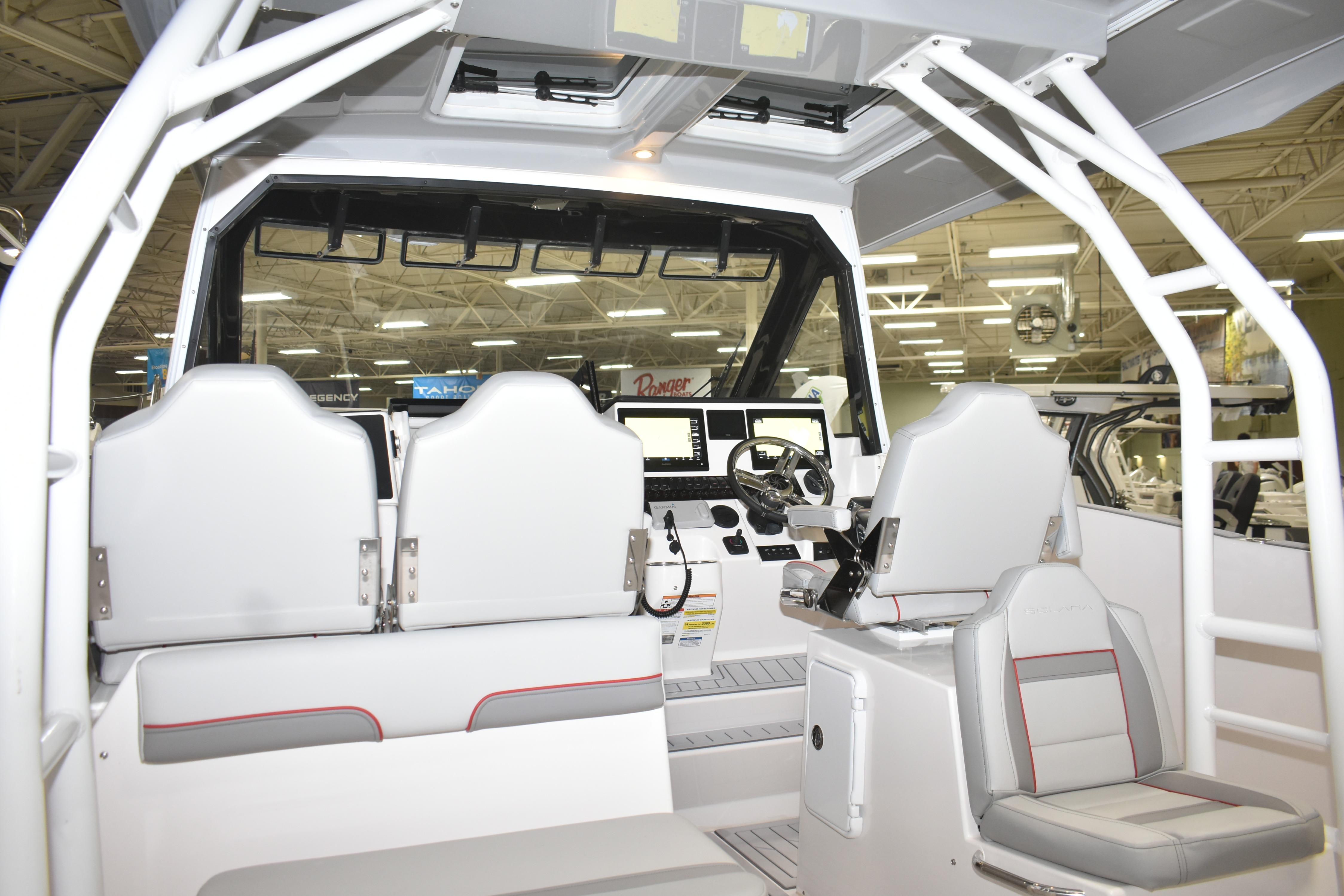 Interior view of 2025 Solara S-310 CW boat with modern seating and control panel.