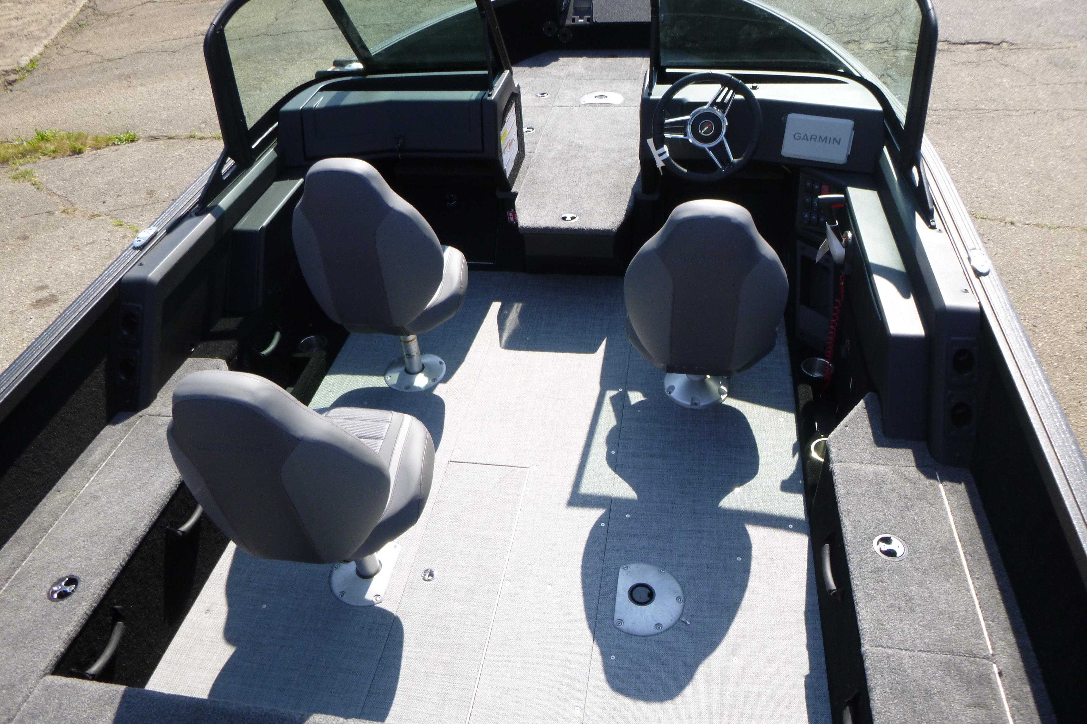 2024 Alumacraft Competitor 185X Sport interior with two seats and steering console.