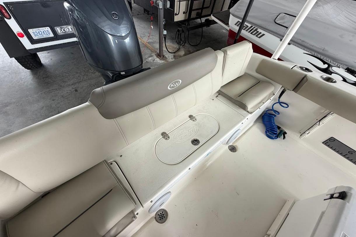 2024 Key West 219 FS boat interior with seating and storage compartments.