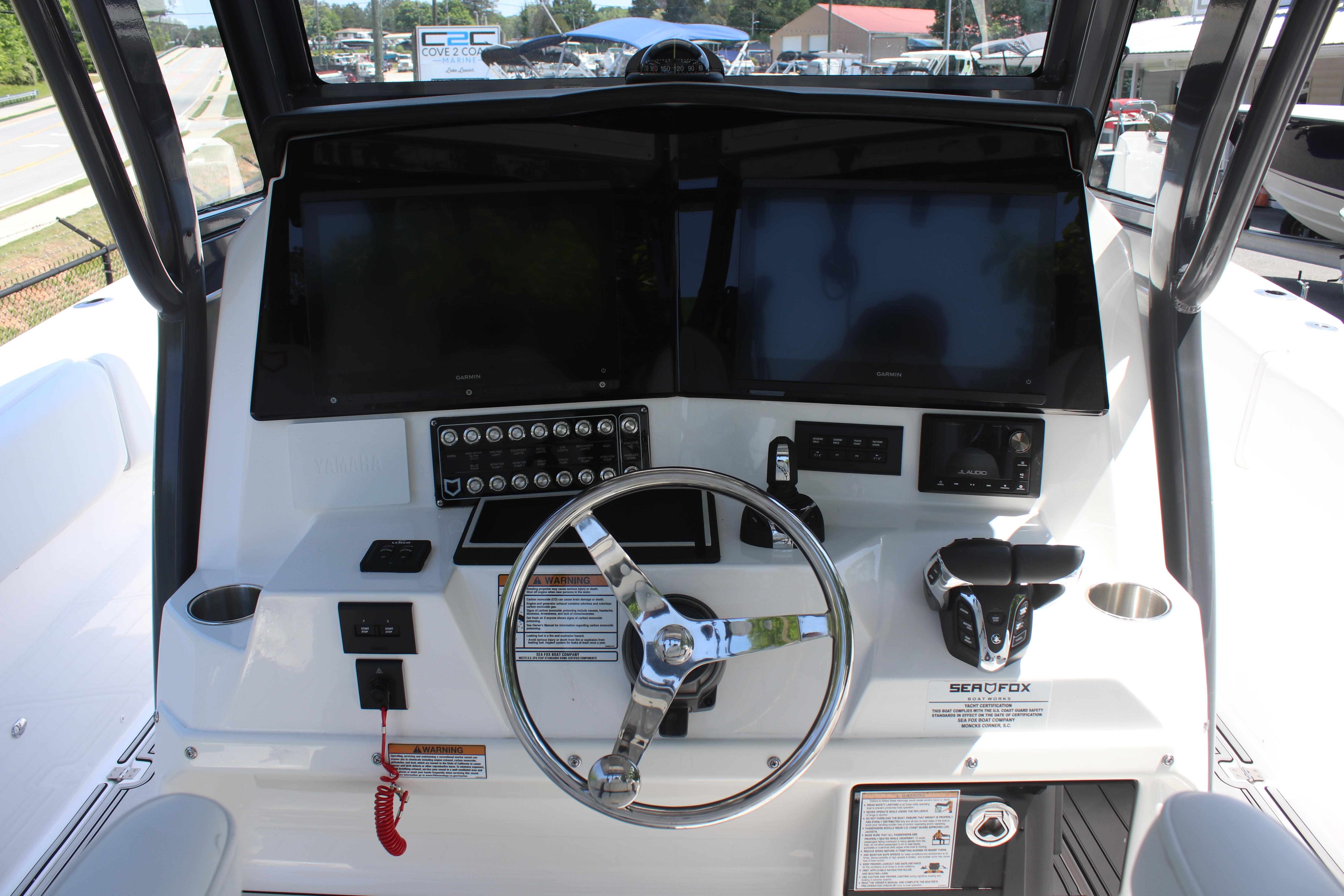 2025 Sea Fox 328 Commander helm with dual screens and modern controls.