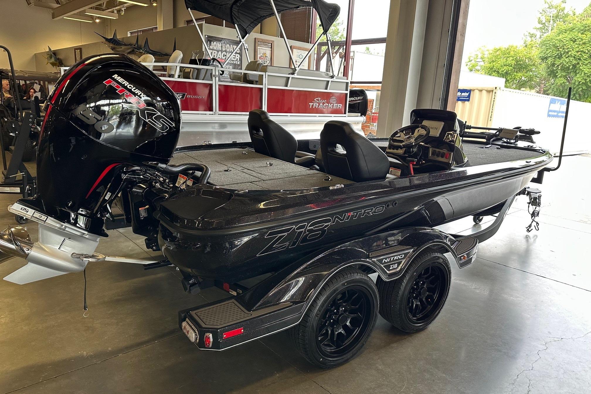 2026 Nitro Z18 Pro boat with Mercury engine displayed indoors.