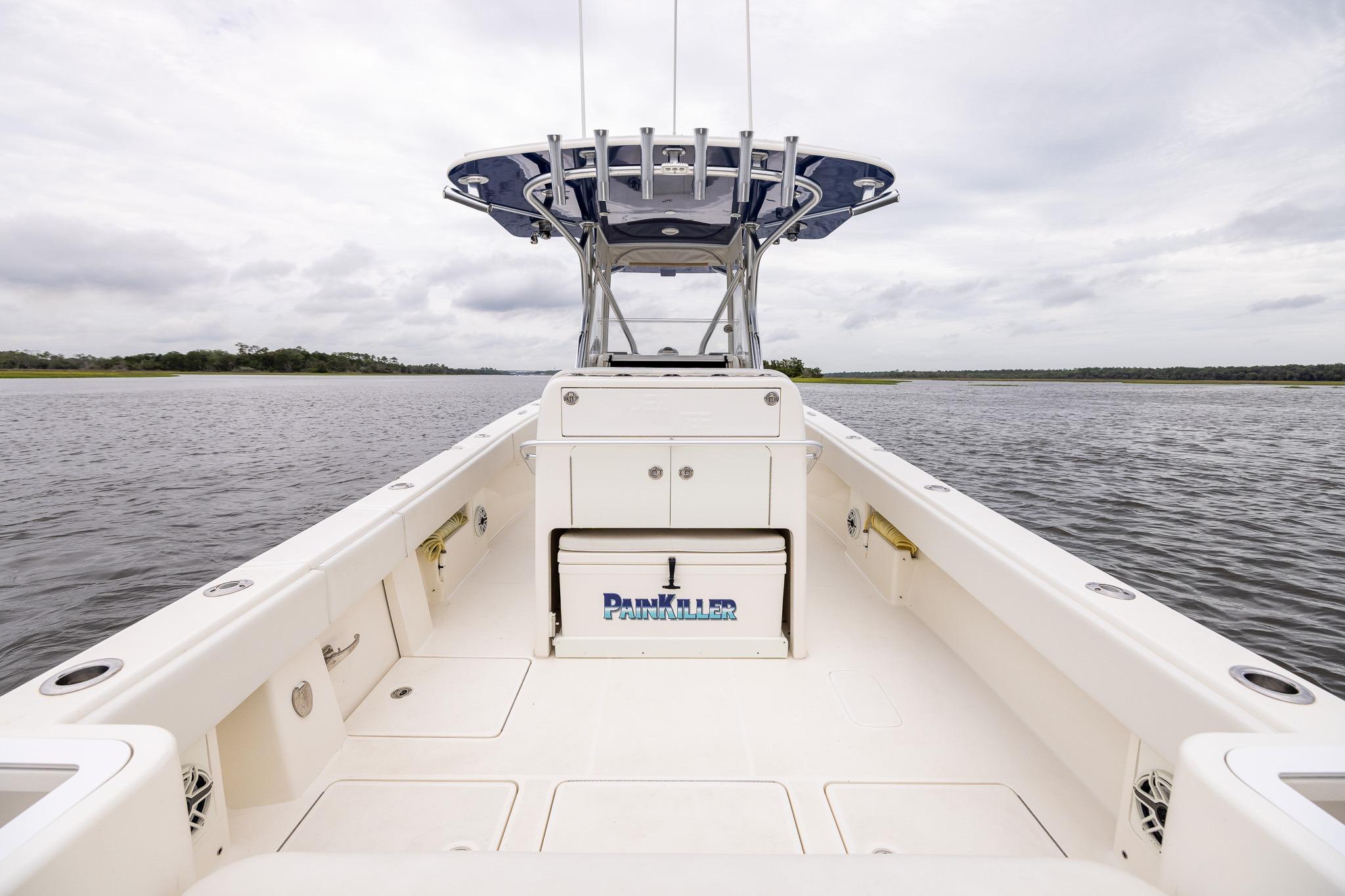 2019 SeaVee 322Z boat on calm water, featuring spacious deck and center console.