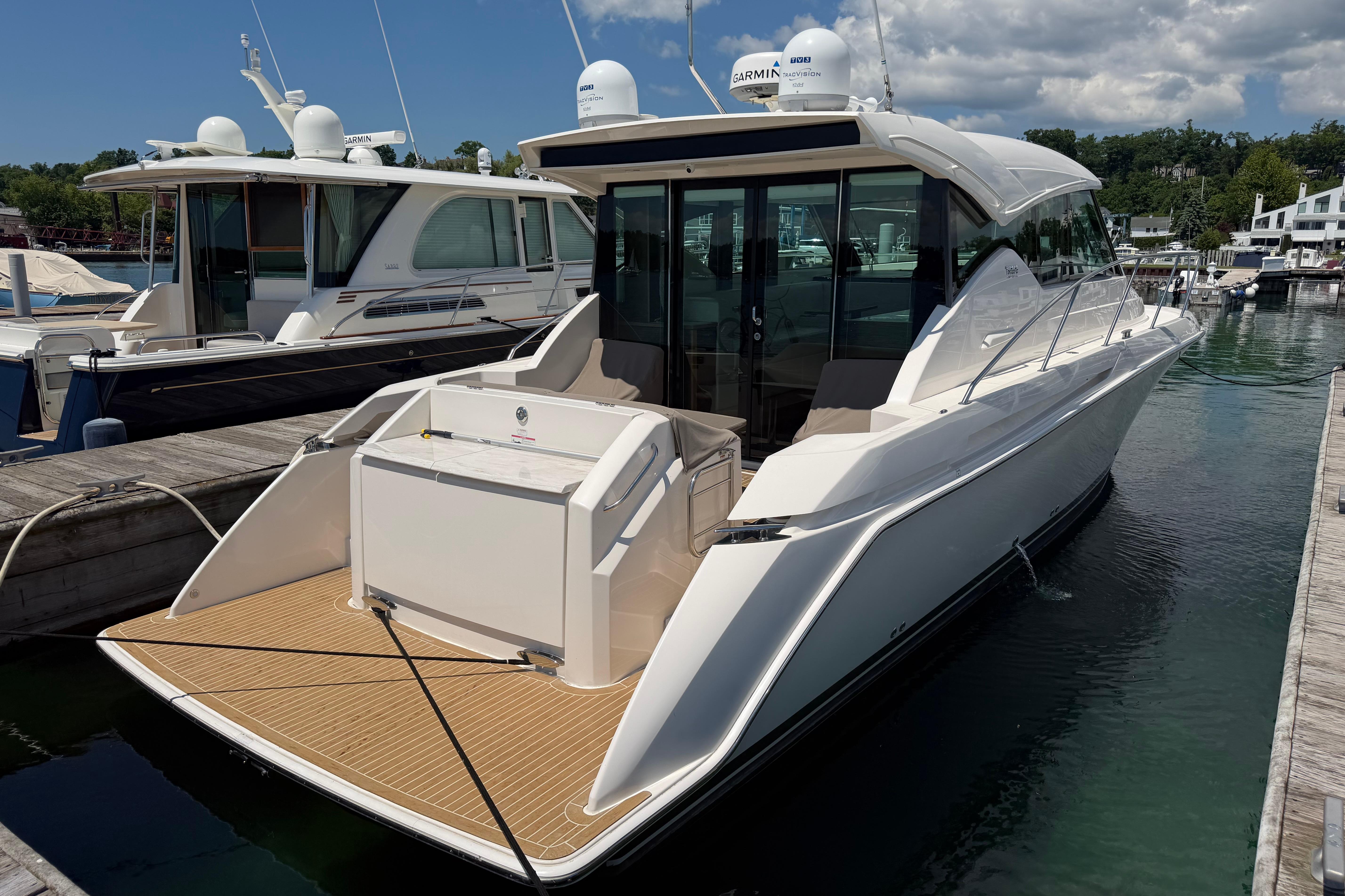 2016 Tiara Yachts C39 Coupe docked at marina, showcasing sleek design and modern features.