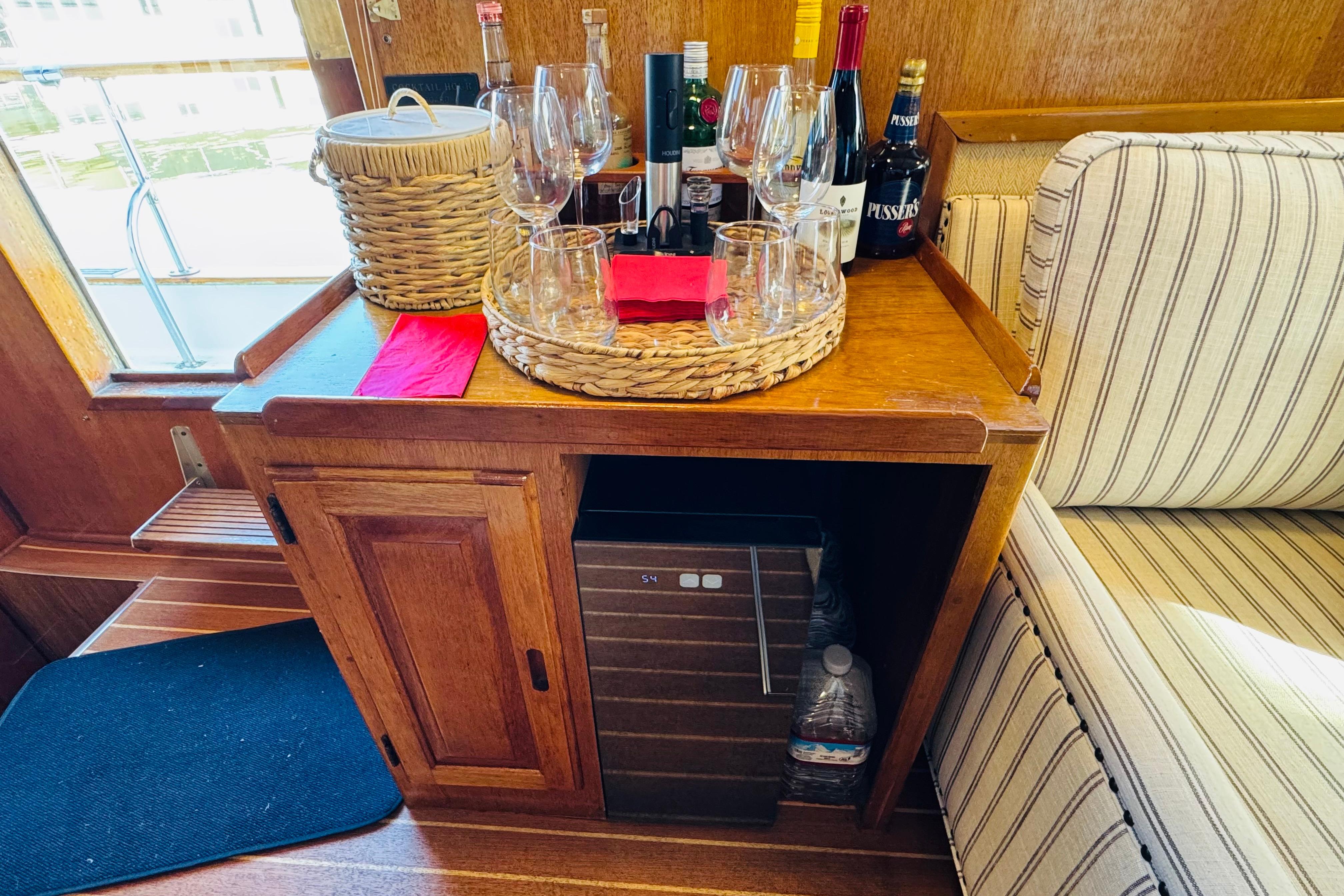 1978 Californian 42 LRC yacht interior with bar setup, wine bottles, and glasses.