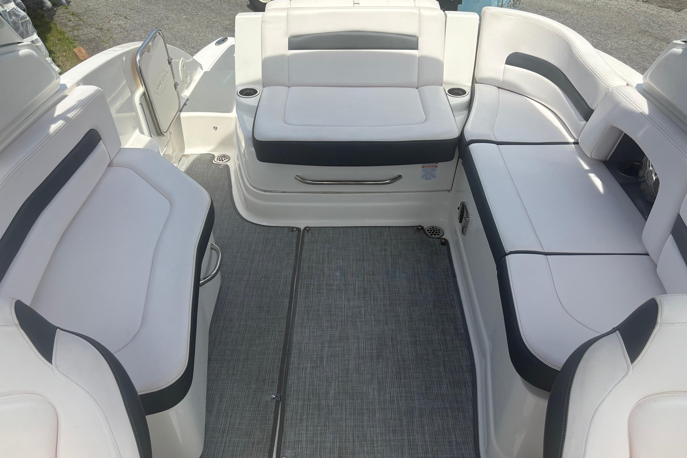 2019 Chaparral 264 Sunesta boat interior with spacious white seating and modern design.