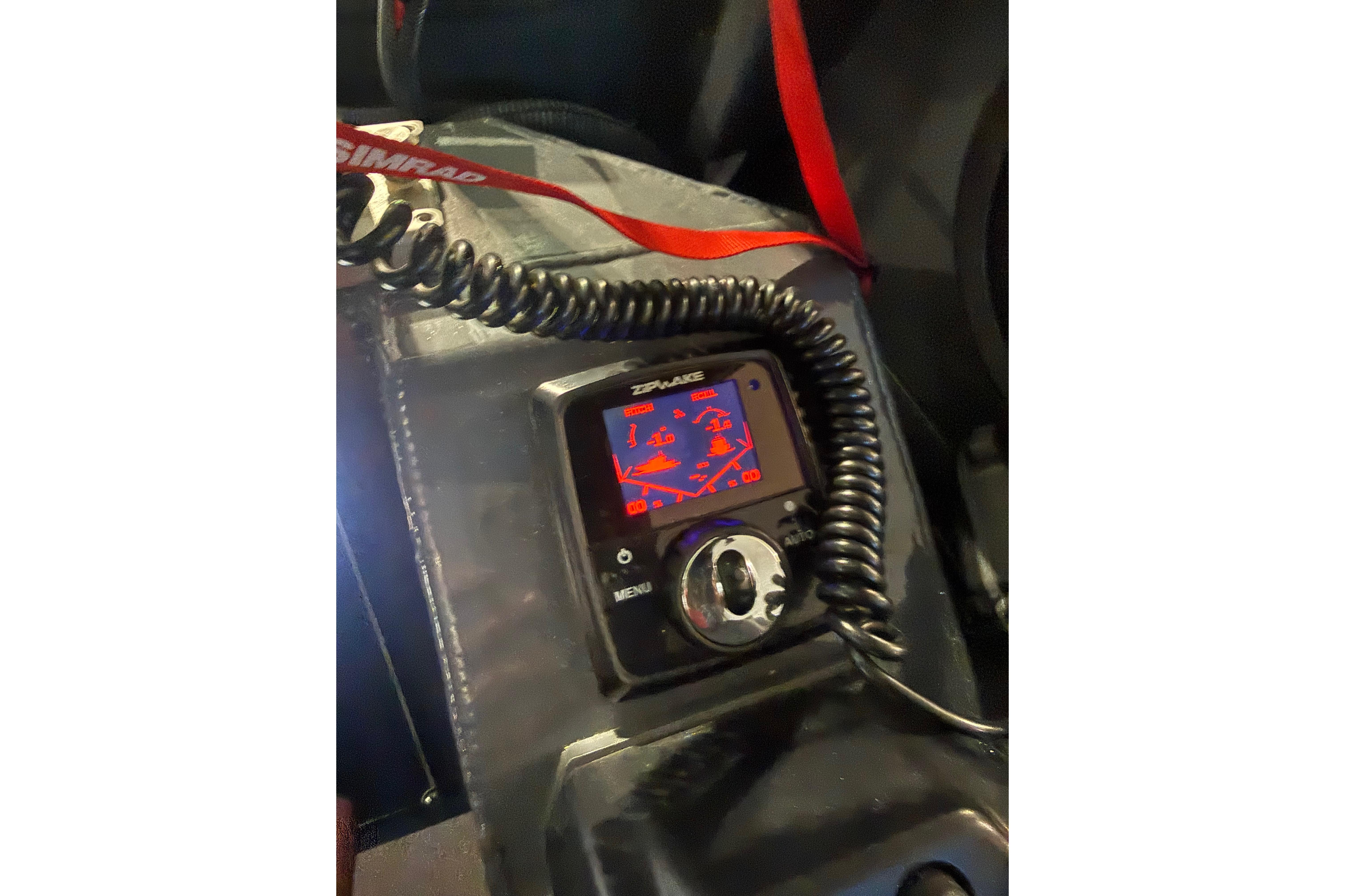 Close-up of a Simrad marine device in a 2022 Hewescraft 270 Alaskan Hardtop boat.