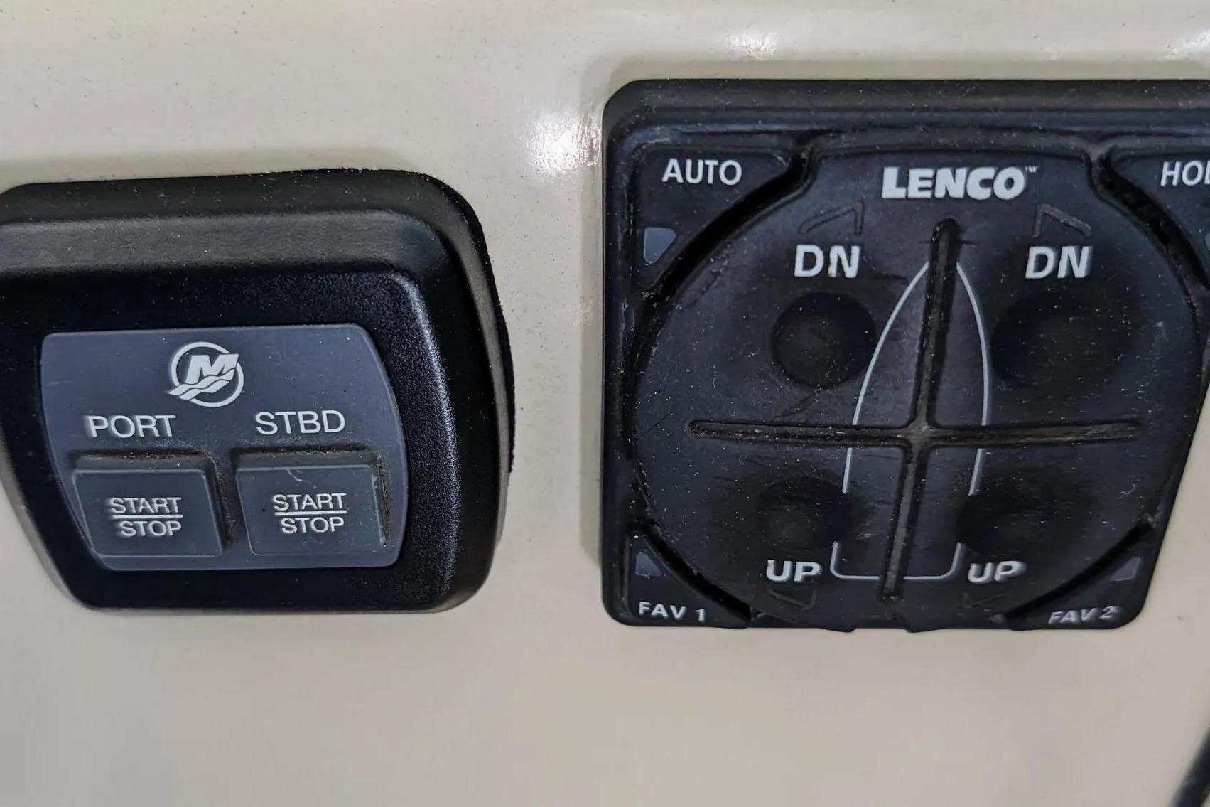 Control panel of a 2017 Boston Whaler 320 Vantage boat with Lenco trim tabs.