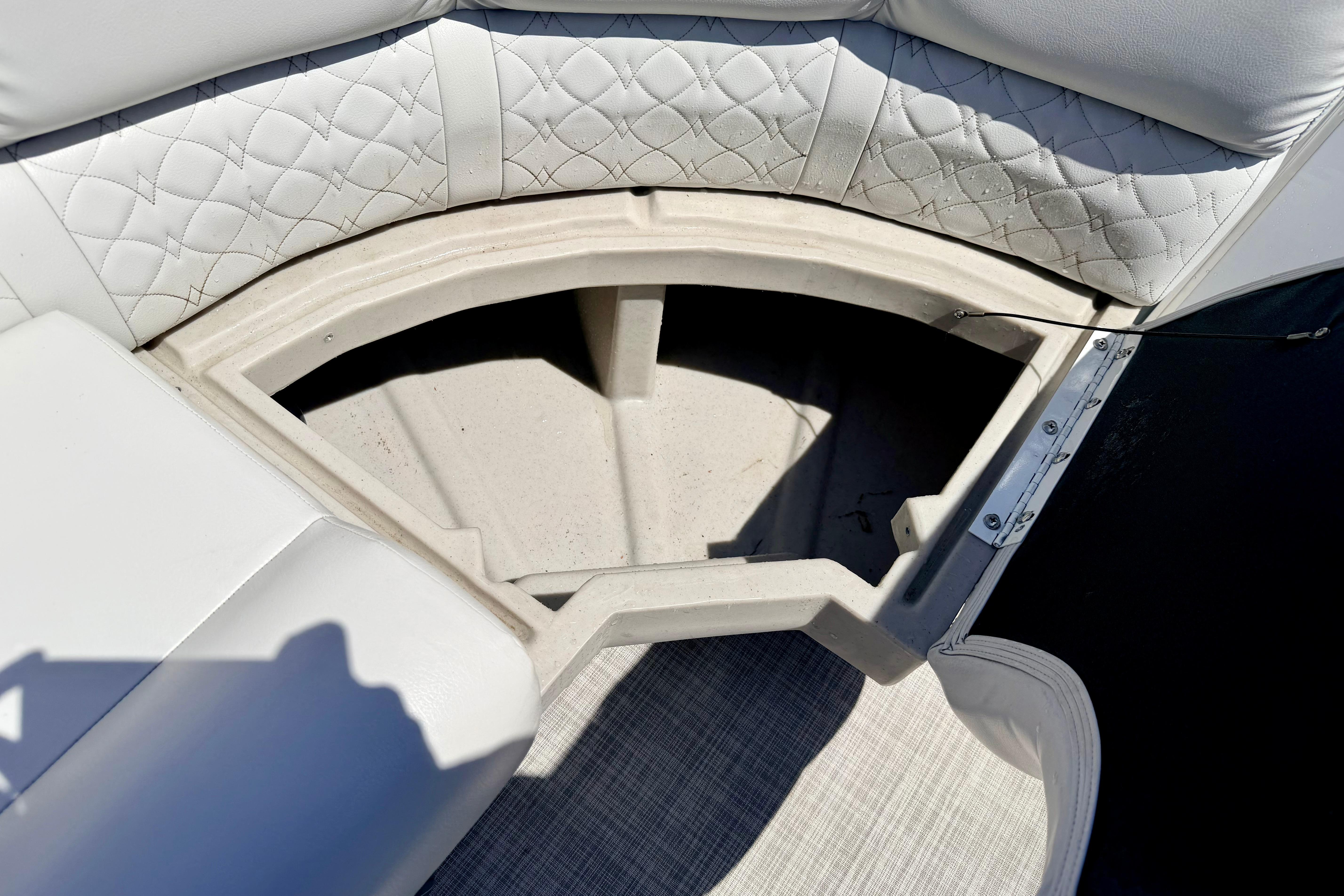 Storage compartment in 2019 Crestliner 240 Rally DX CW boat with quilted seating.