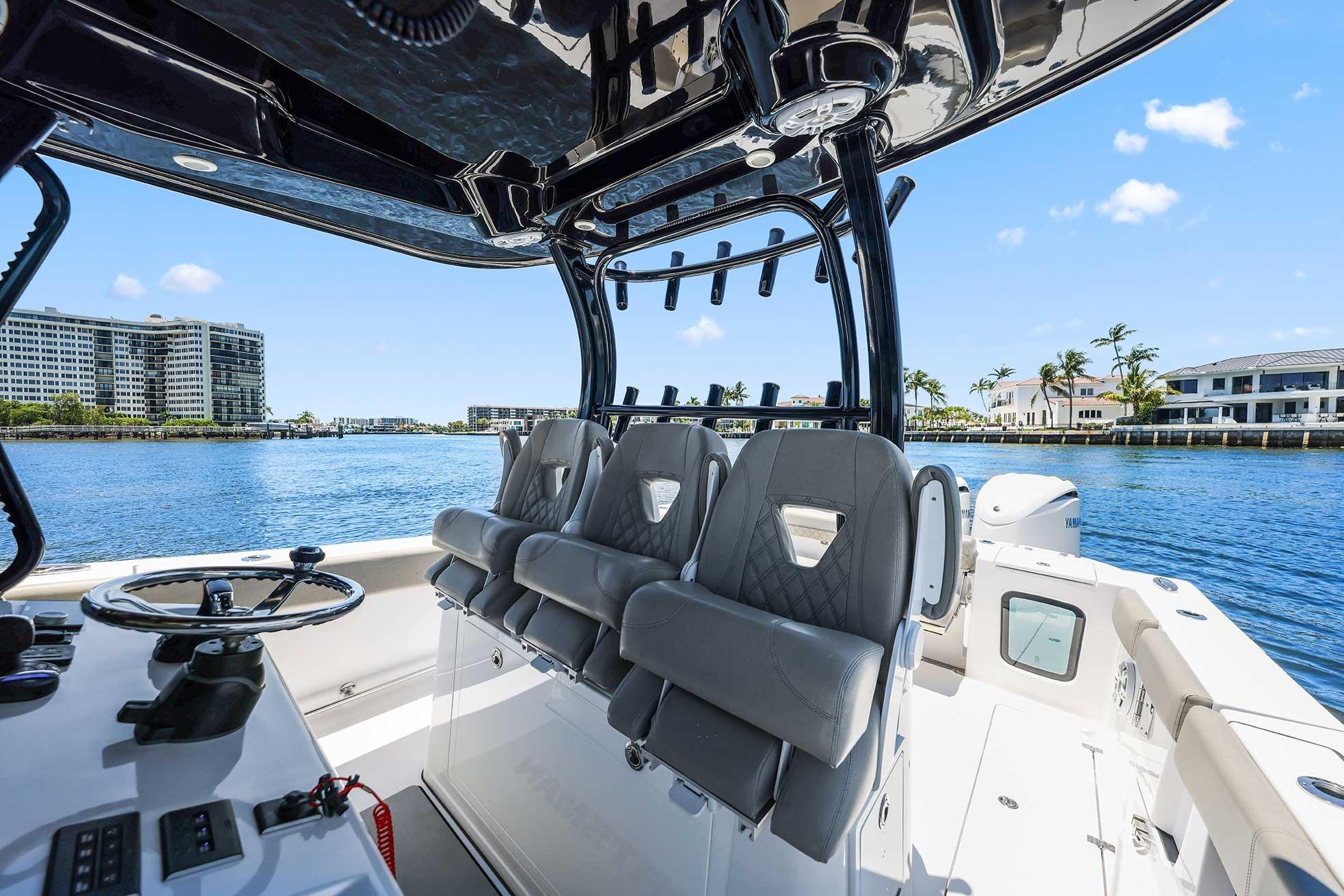 2024 Sportsman Open 352 Center Console boat interior with luxurious seating and waterfront view.